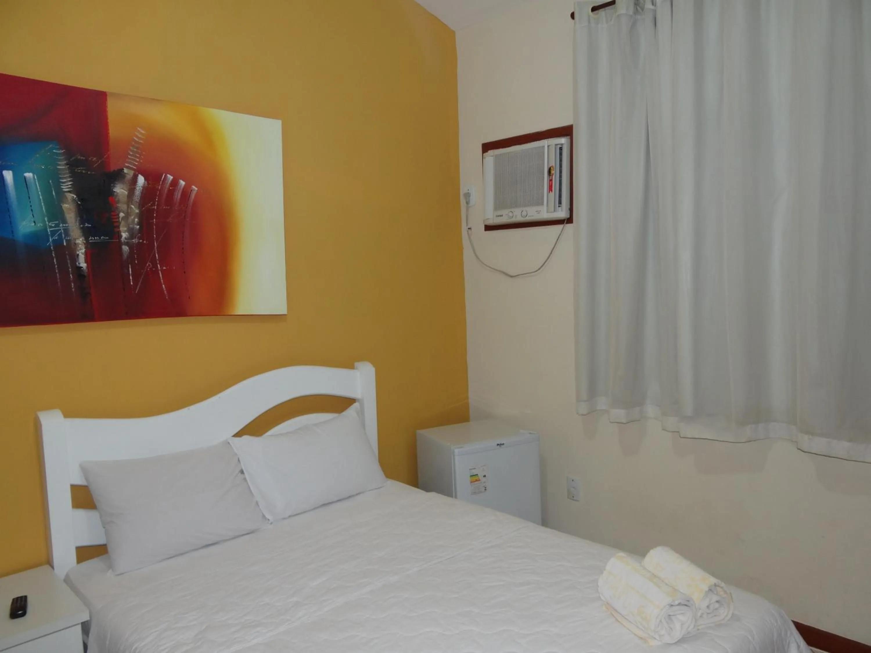 Bed in Pousada Bon Vivant