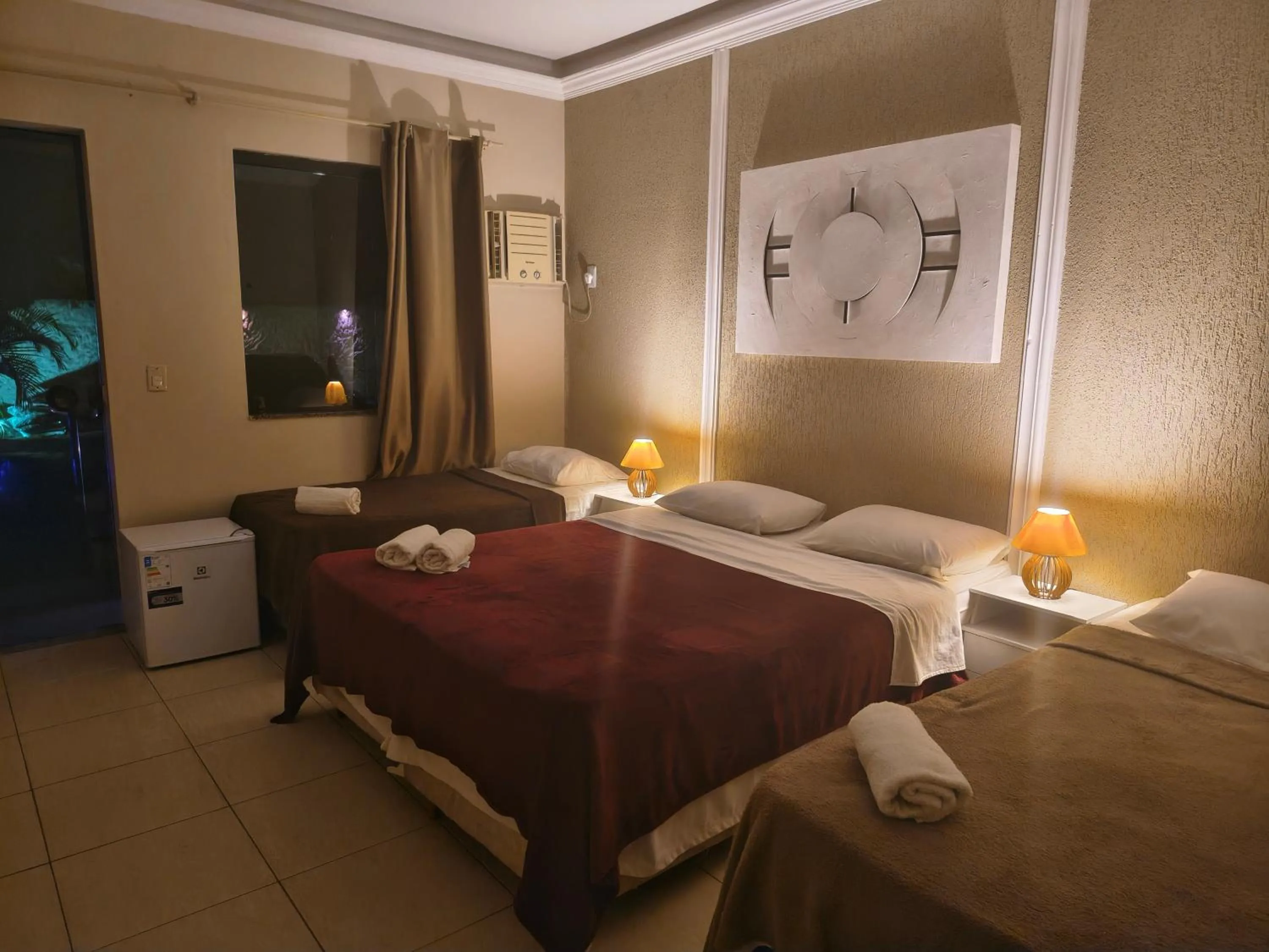 Bed in Pousada Bon Vivant