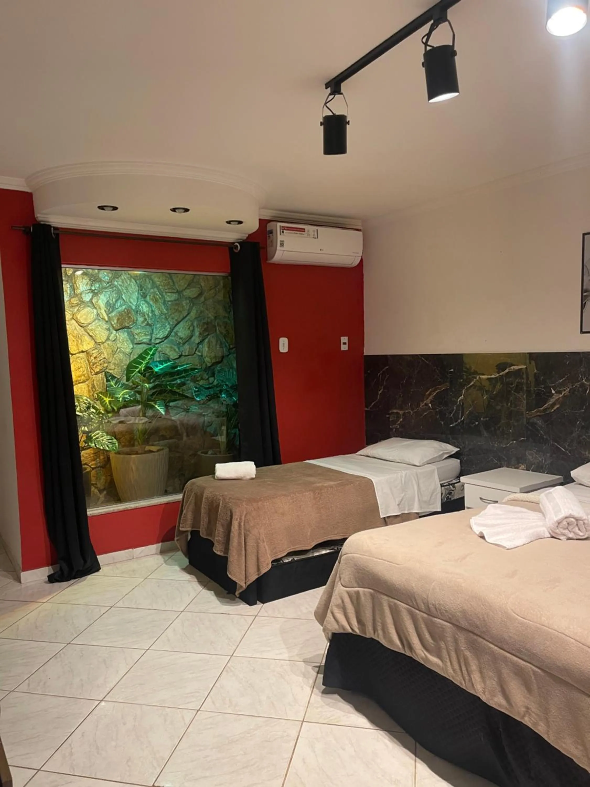 Bed in Pousada Bon Vivant