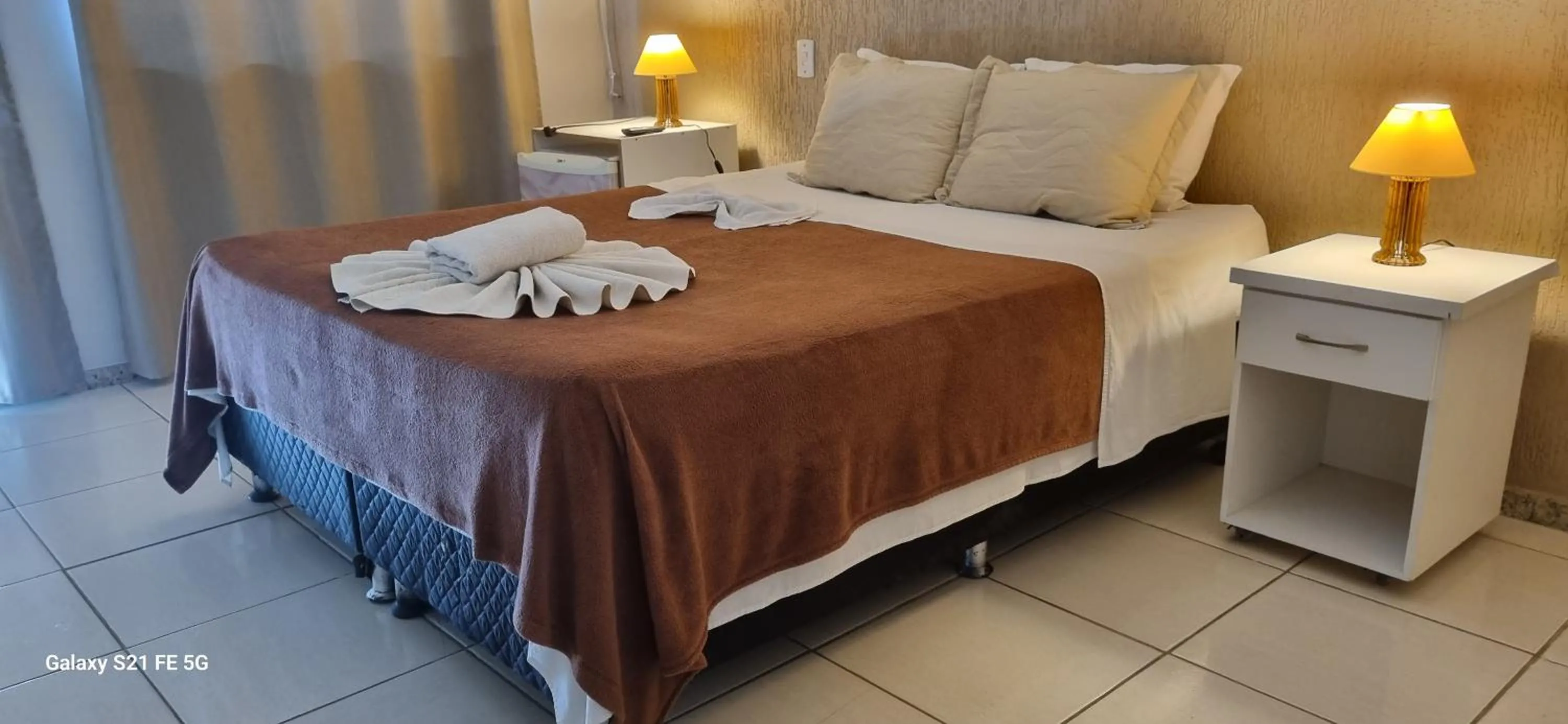 Bed in Pousada Bon Vivant