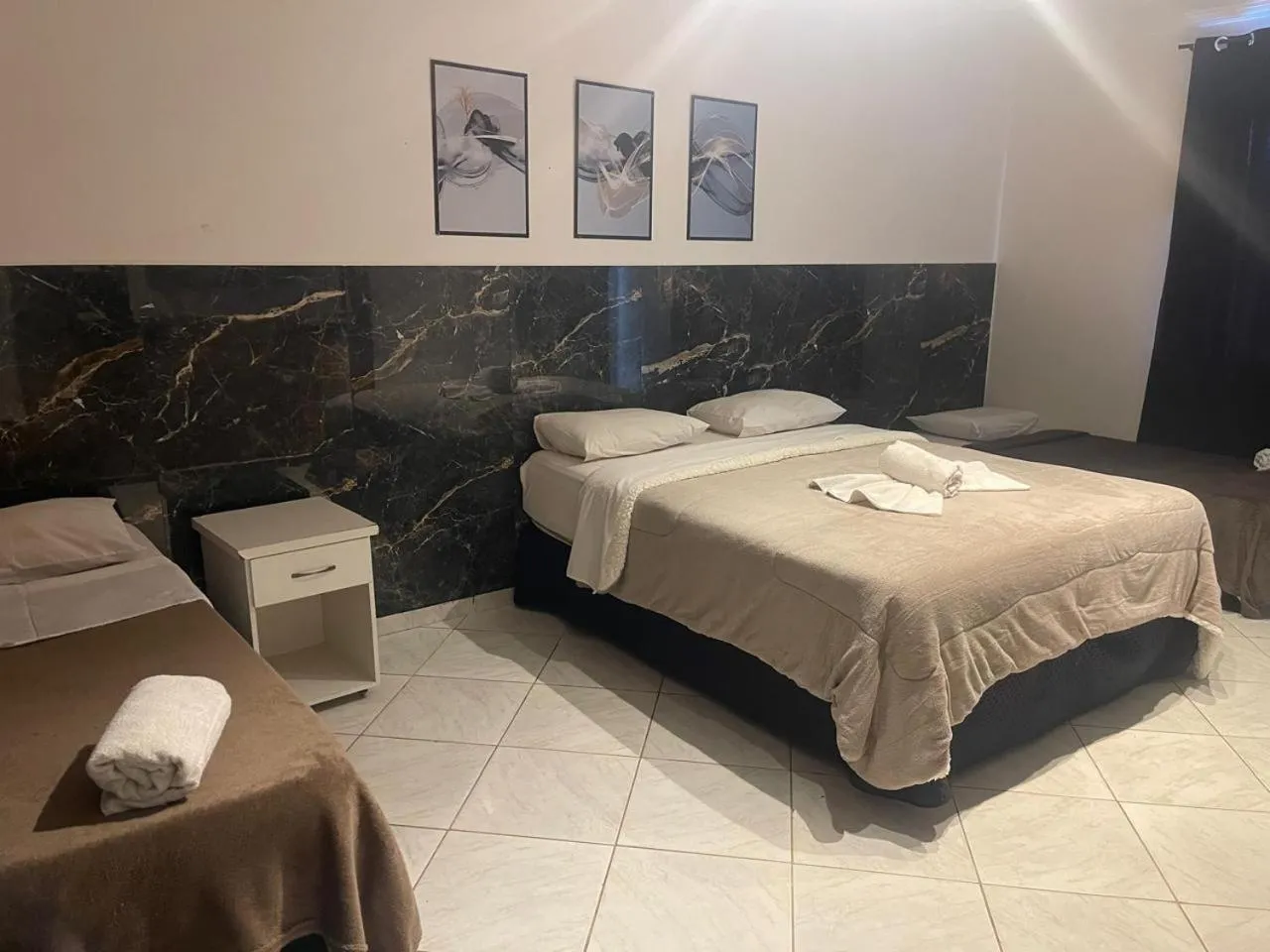 Bed in Pousada Bon Vivant