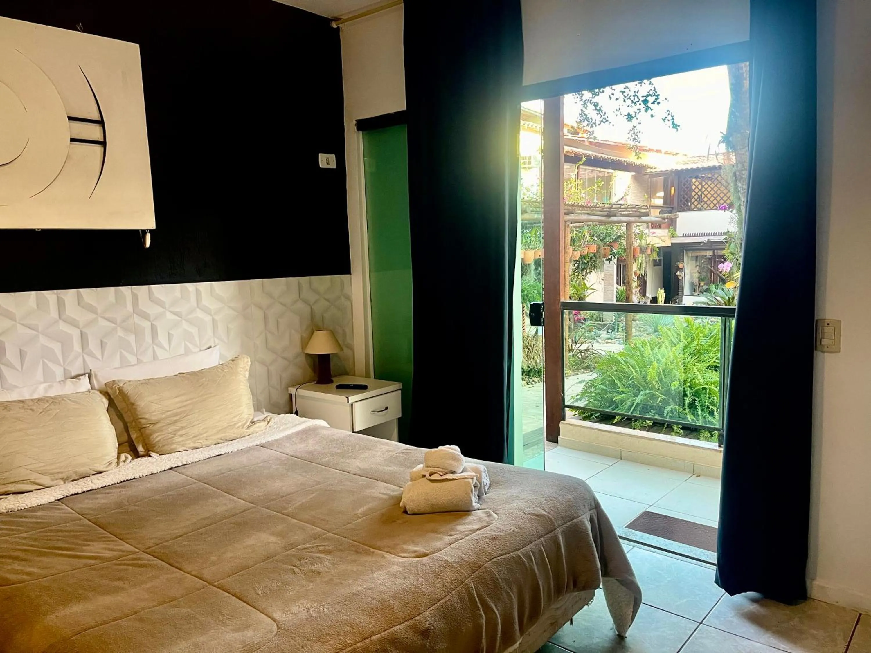 Bed in Pousada Bon Vivant