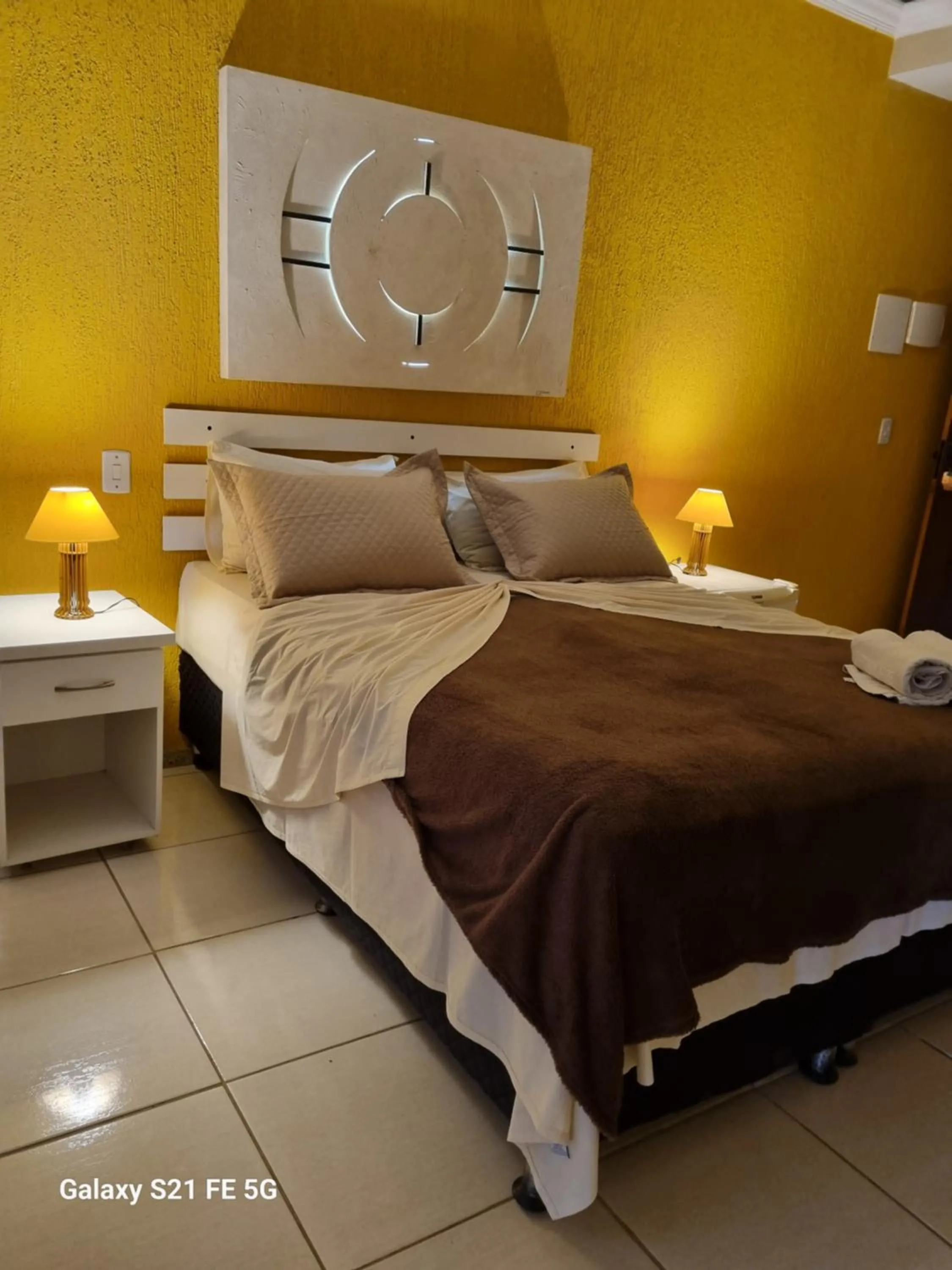 Bed in Pousada Bon Vivant