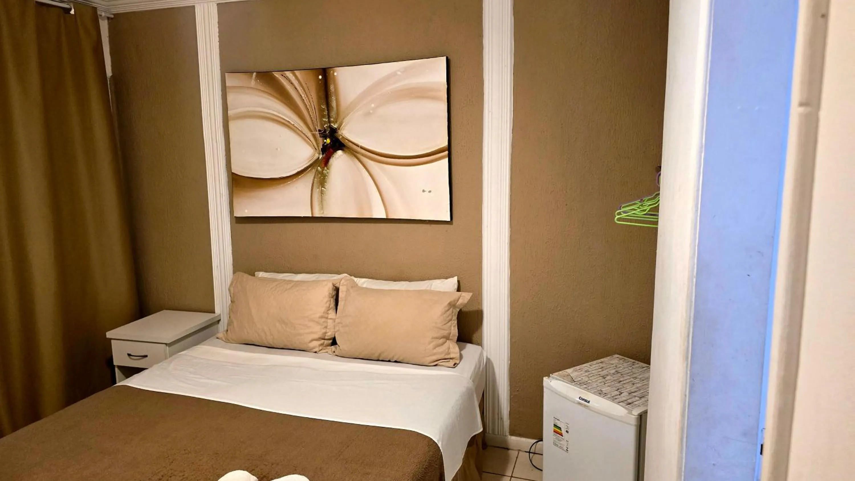 Bed in Pousada Bon Vivant