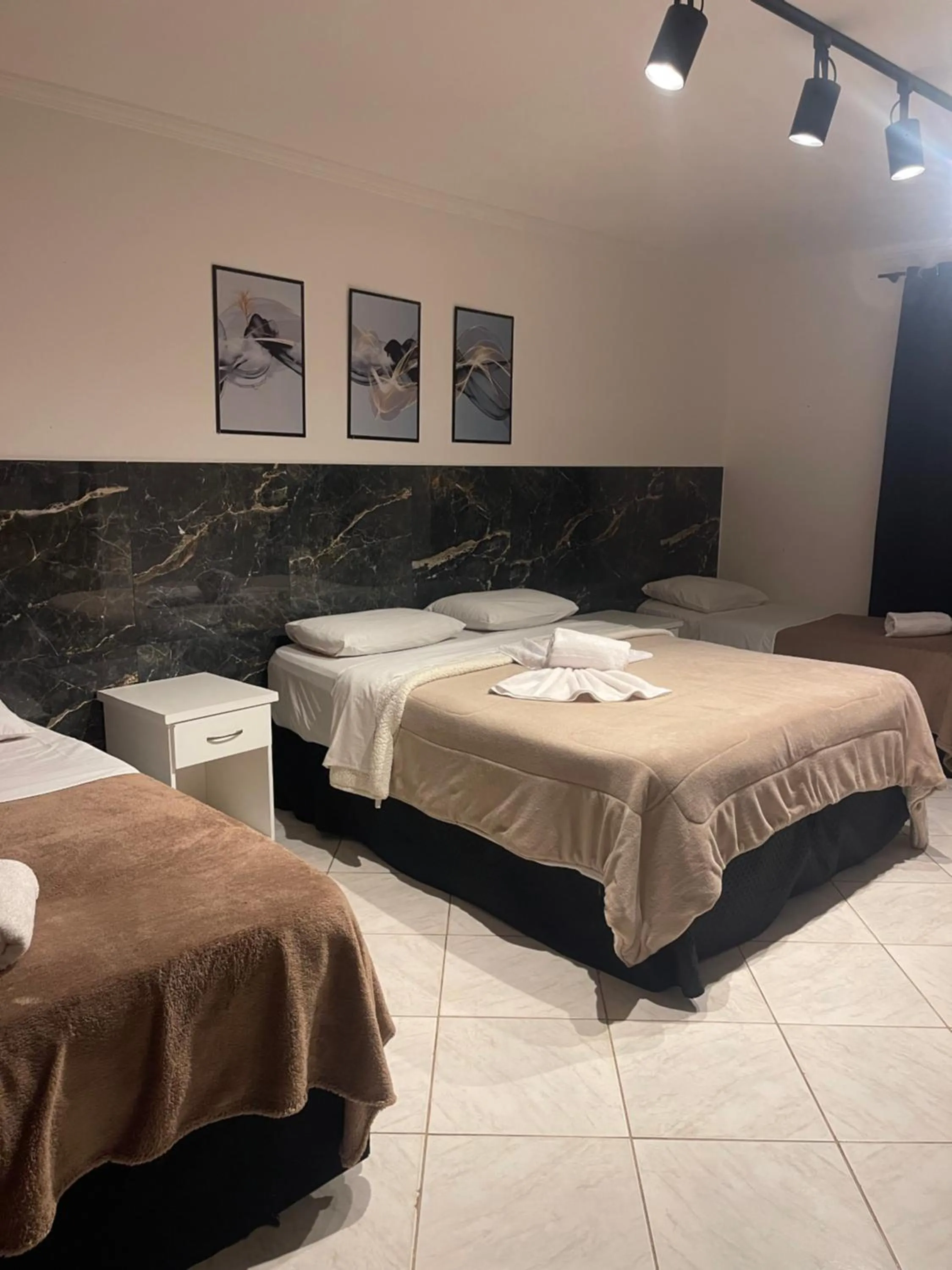 Bed in Pousada Bon Vivant