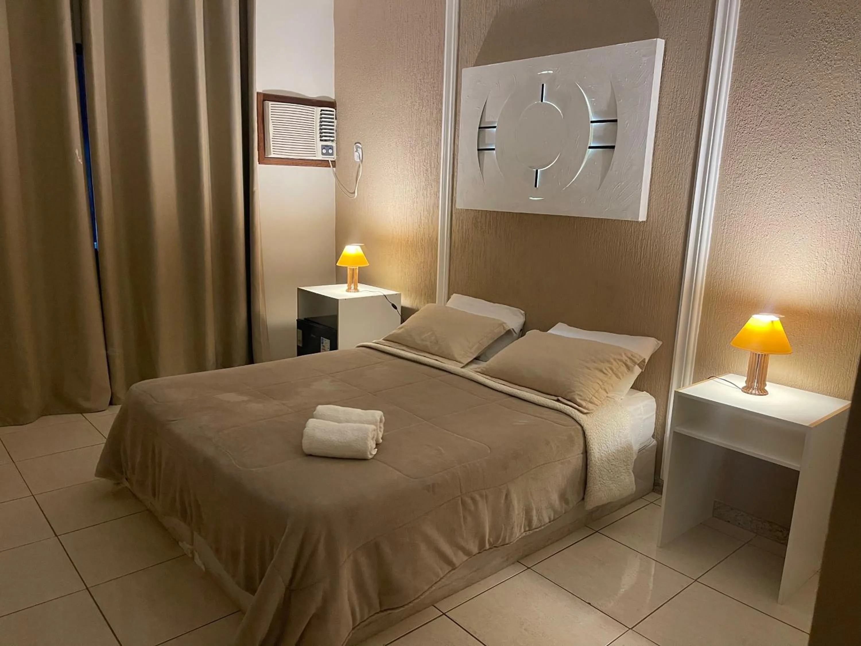 Bed in Pousada Bon Vivant