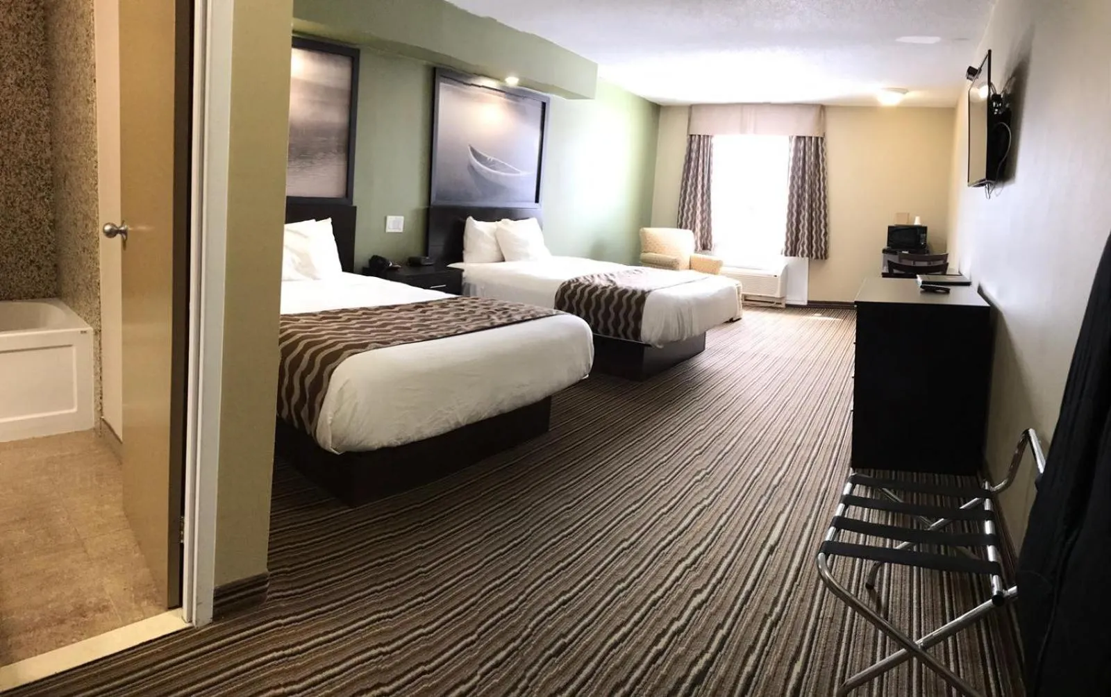 Photo of the whole room, Bed in red maple inn and suites