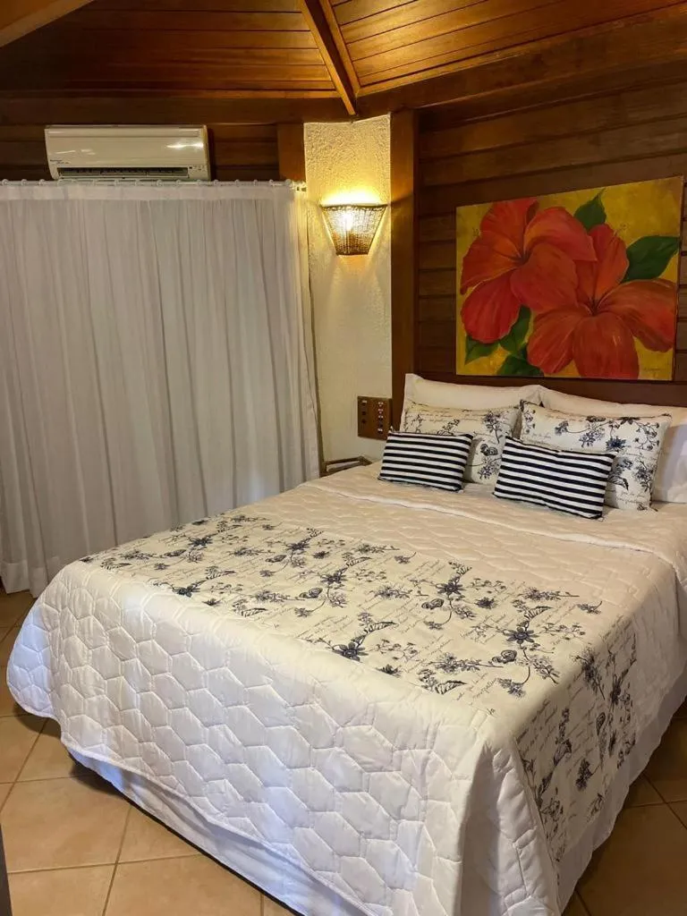 Bed in Pousada Vitorino