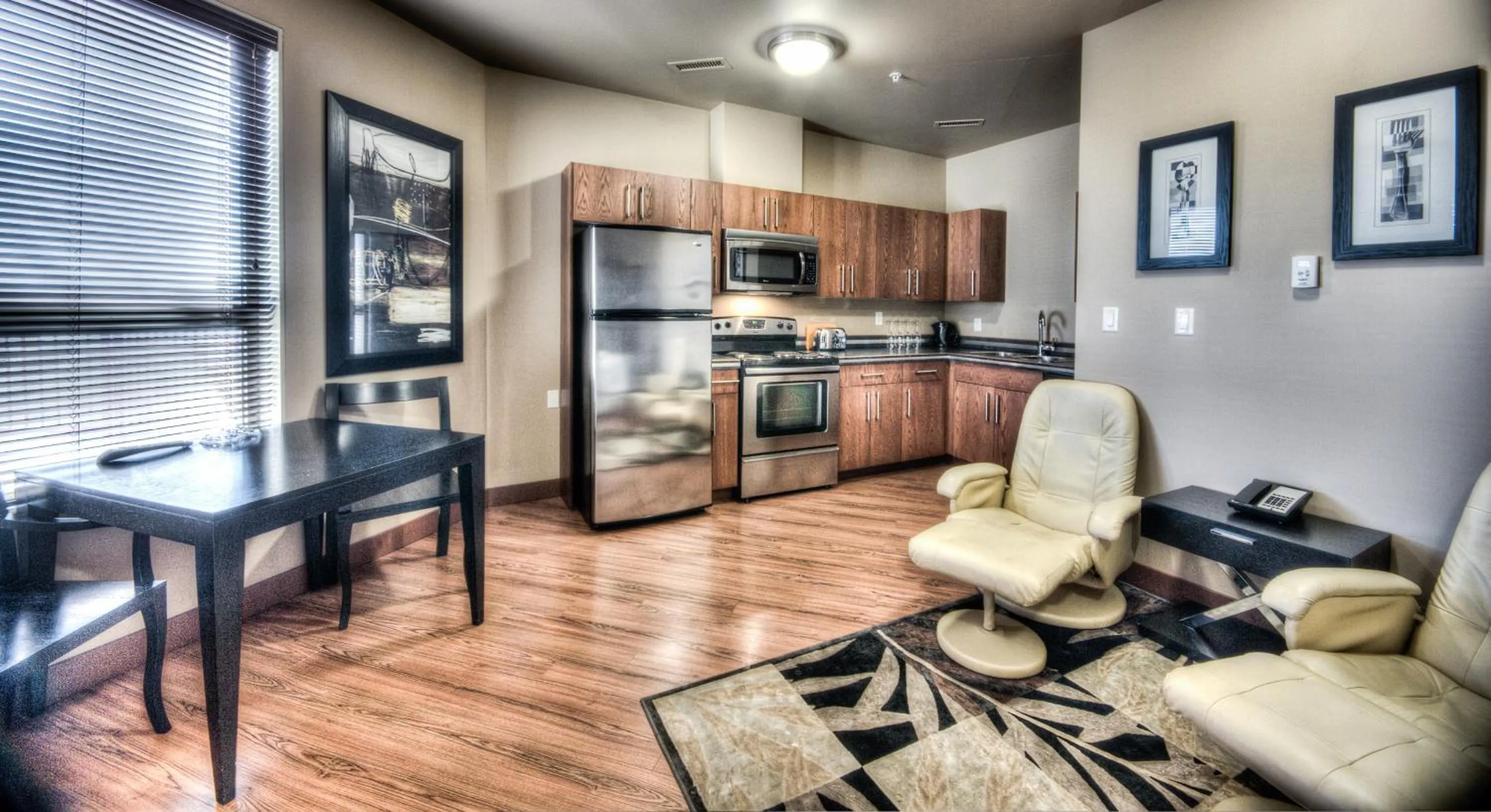 Kitchen or kitchenette in Grand Inn & Residence- Grande Prairie