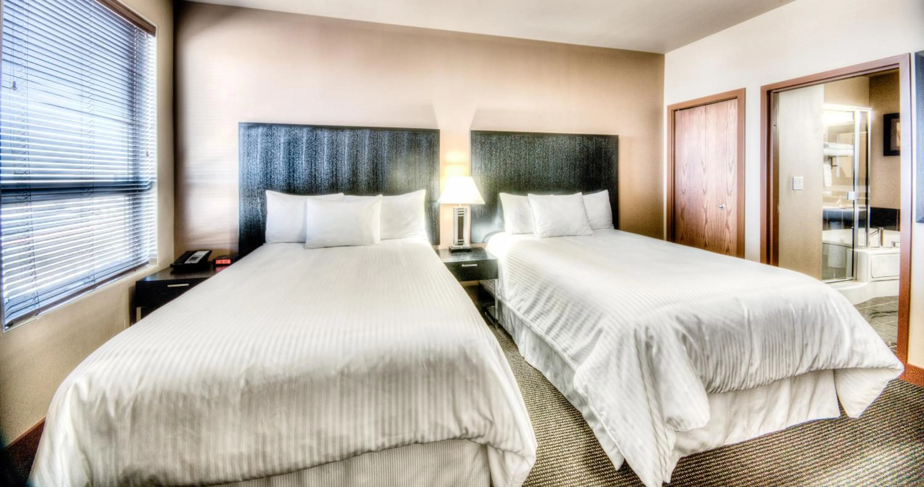 Bedroom, Bed in Grand Inn & Residence- Grande Prairie