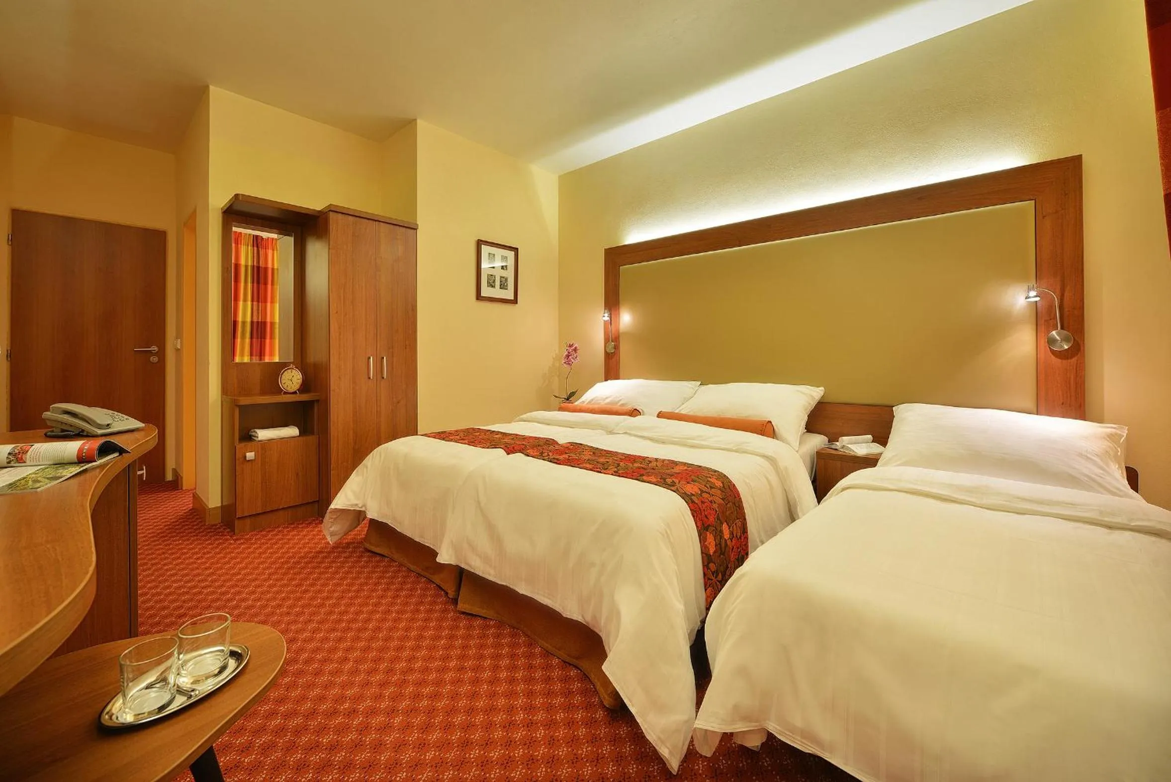 Bed in Maxmilian Lifestyle Resort