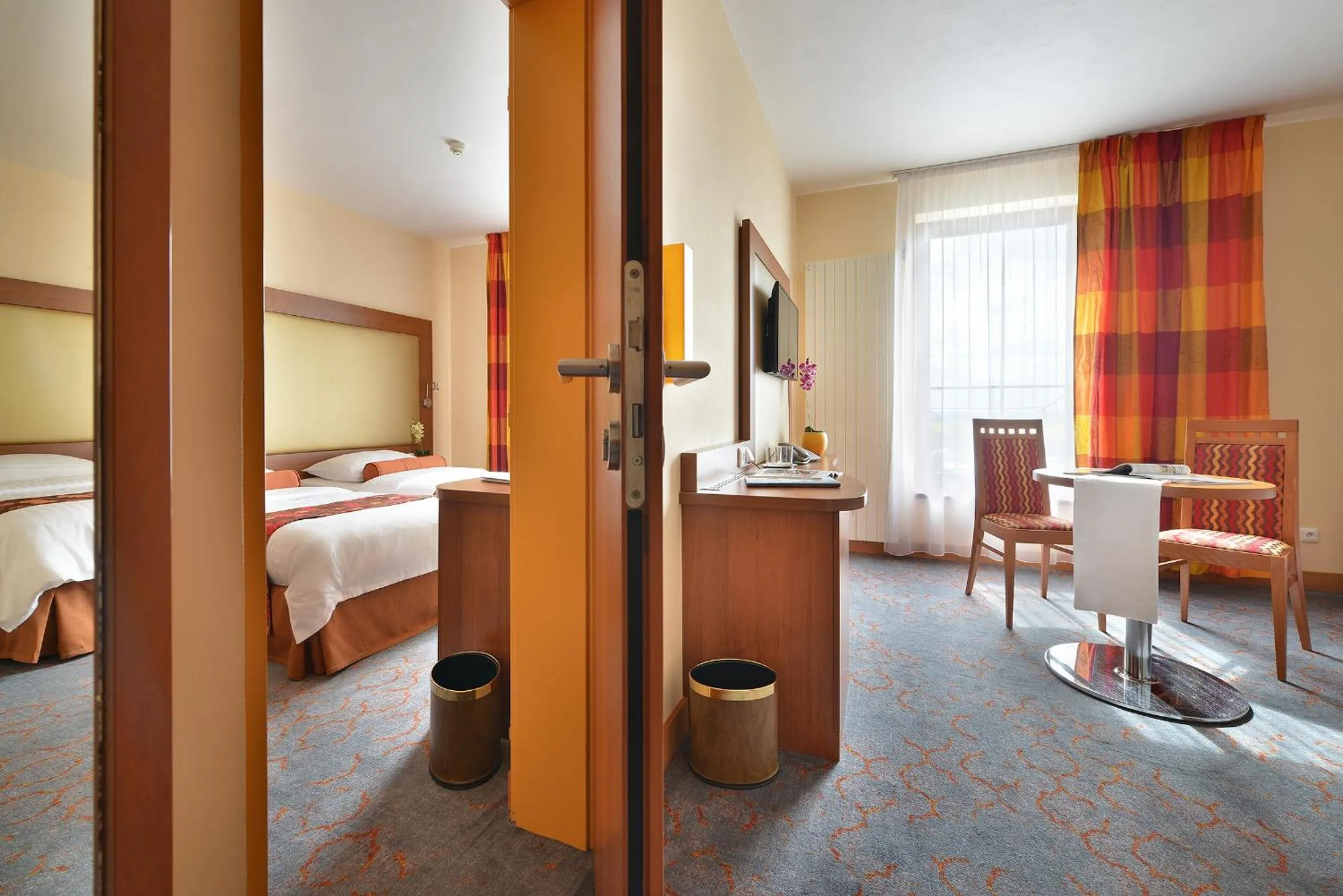 Bed in Maxmilian Lifestyle Resort