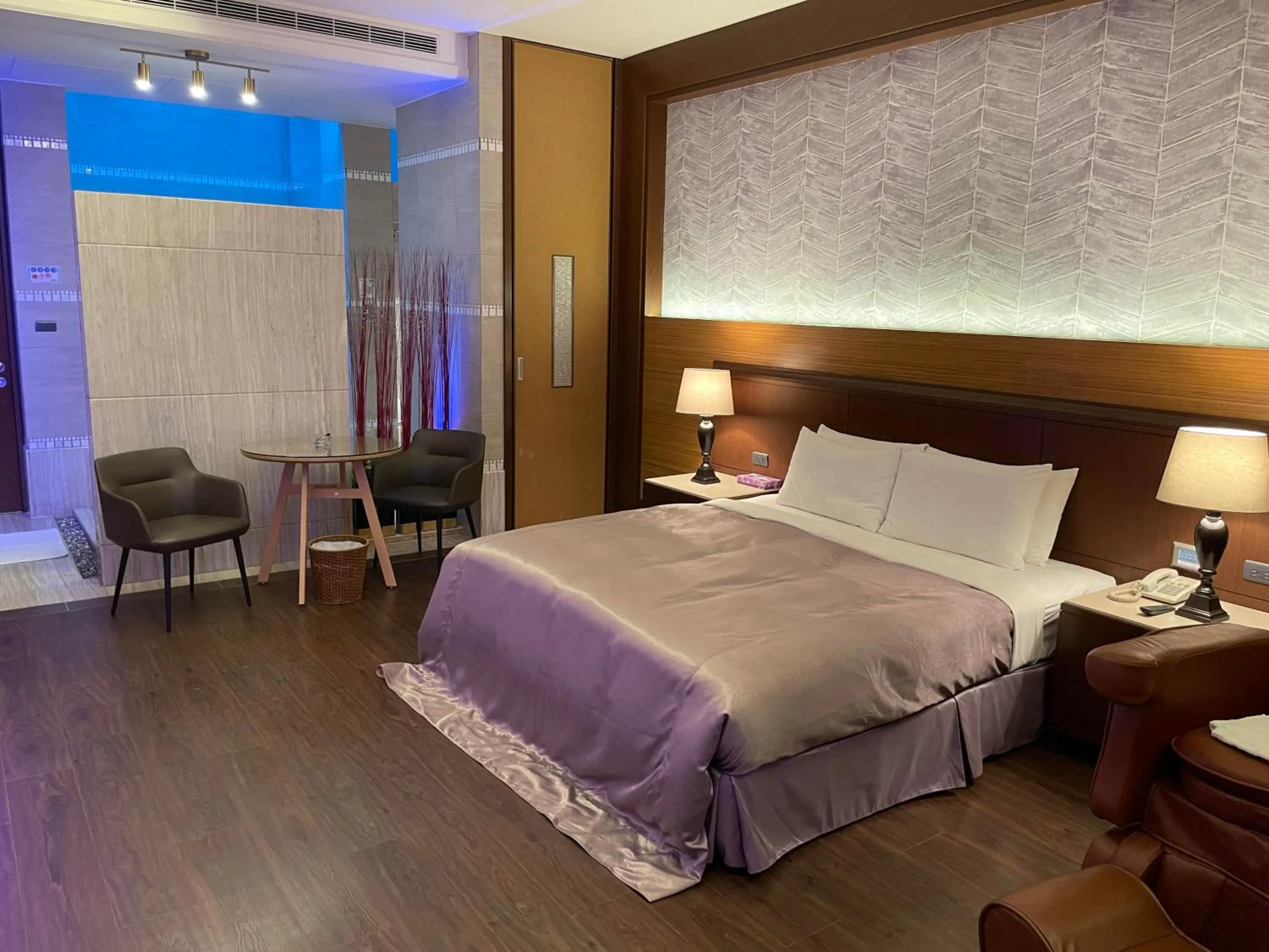 Bed in Purple Garden Motel