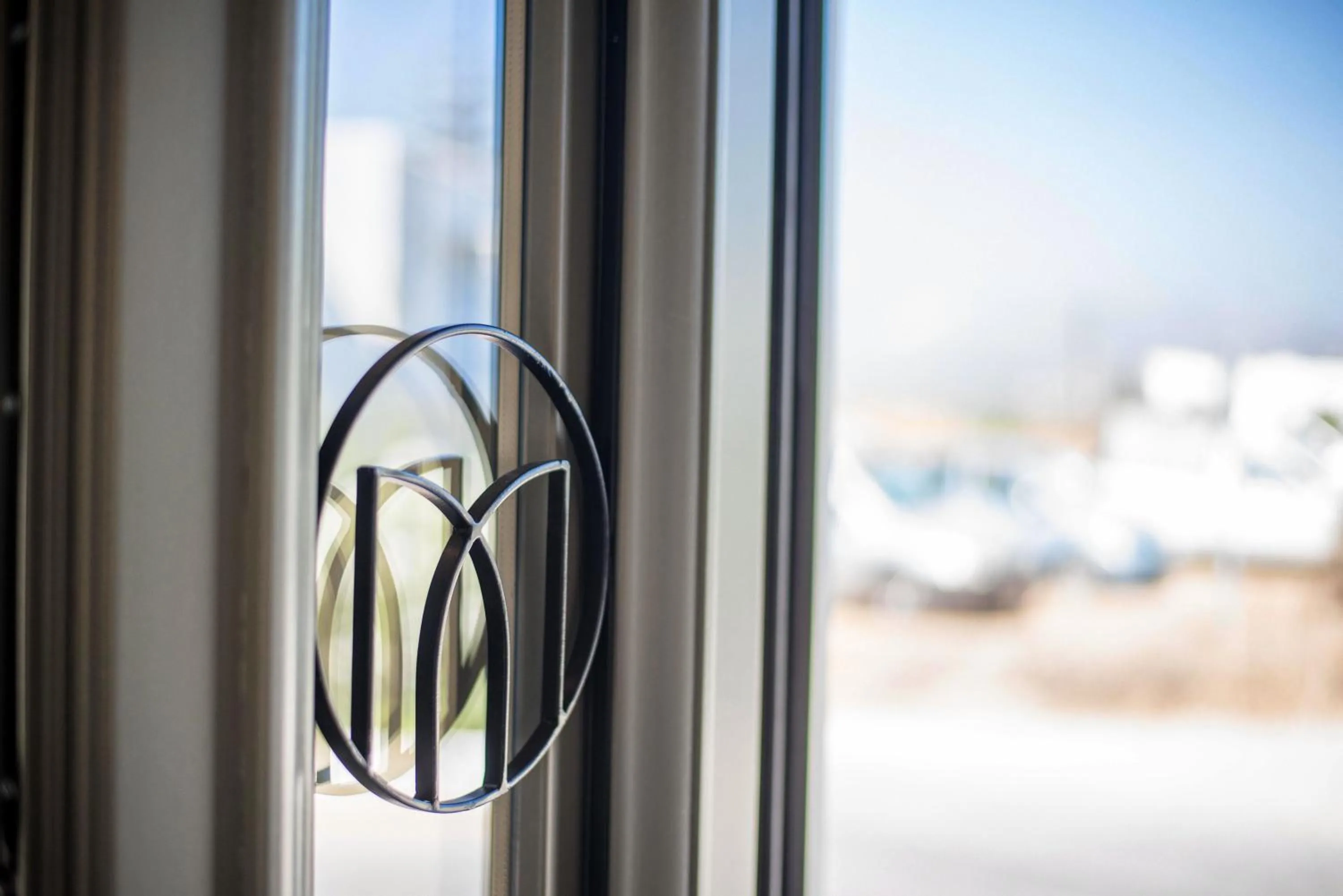 Property logo or sign in Melidron Hotel & Suites