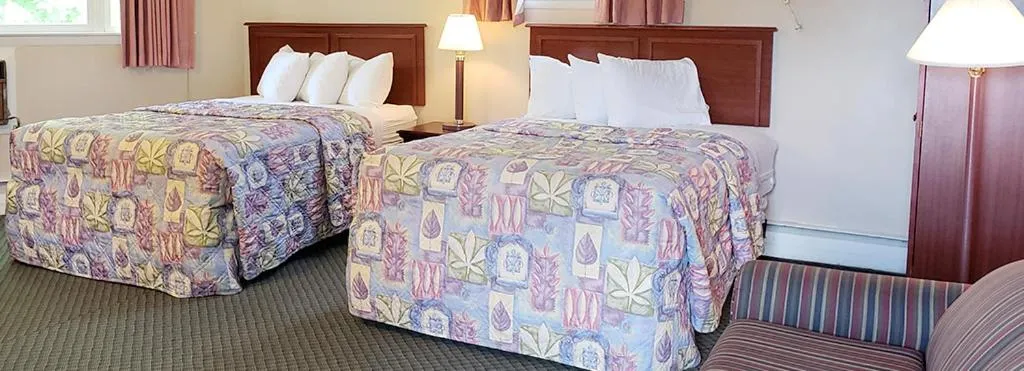 Bed in Gorham Motor Inn