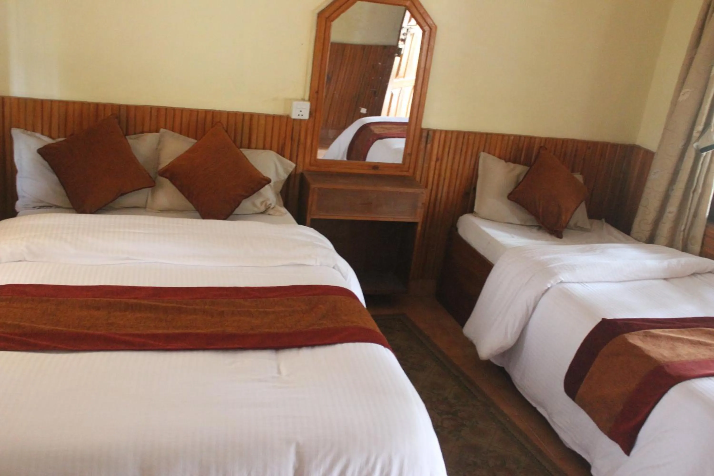 Bed in Chitwan Forest Resort with swimming pool , Chitwan National Park