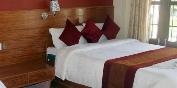 Bed in Chitwan Forest Resort with swimming pool , Chitwan National Park