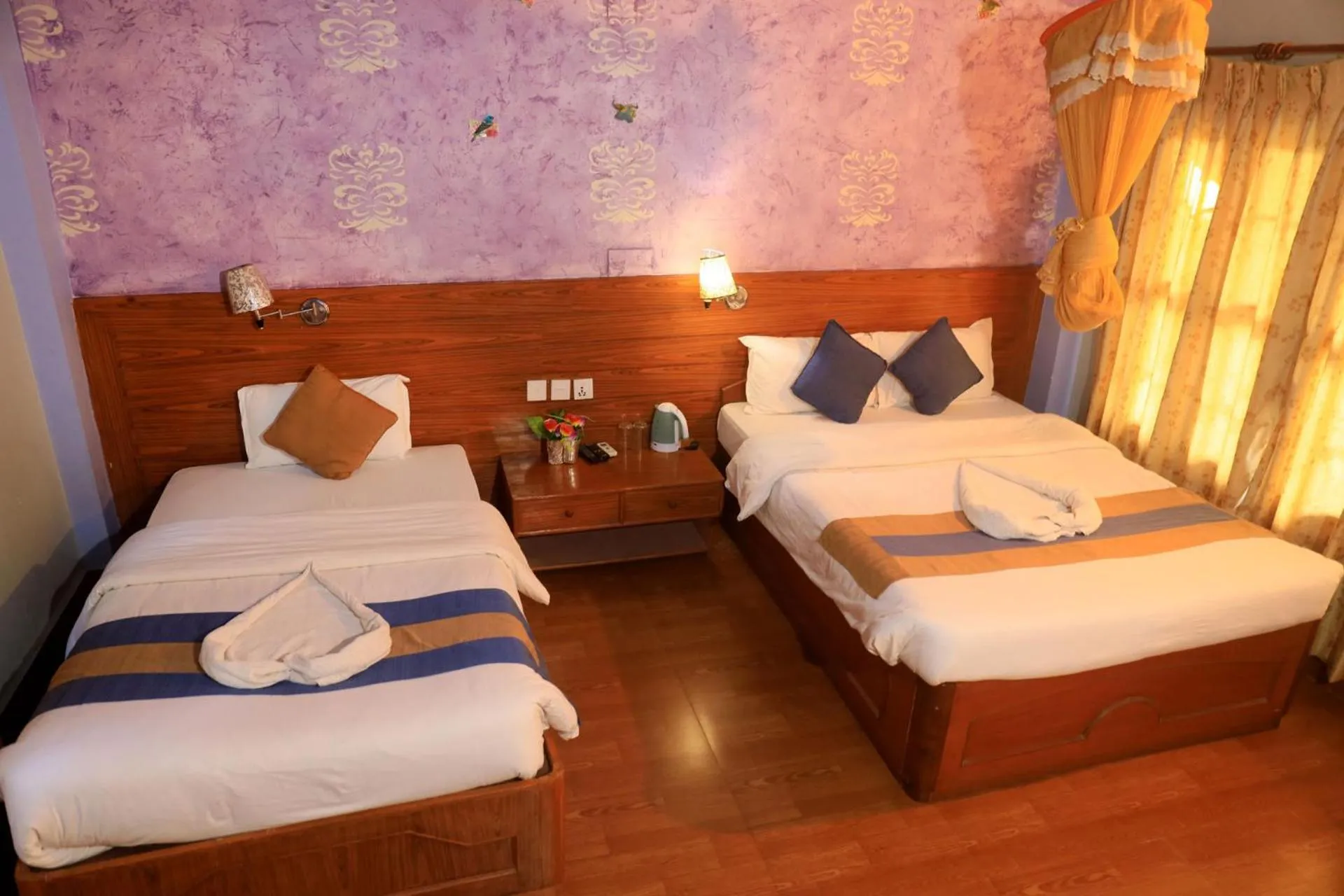 Bed in Chitwan Forest Resort with swimming pool , Chitwan National Park