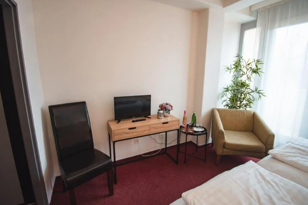 Seating area, Bed in Wellness hotel Lucia