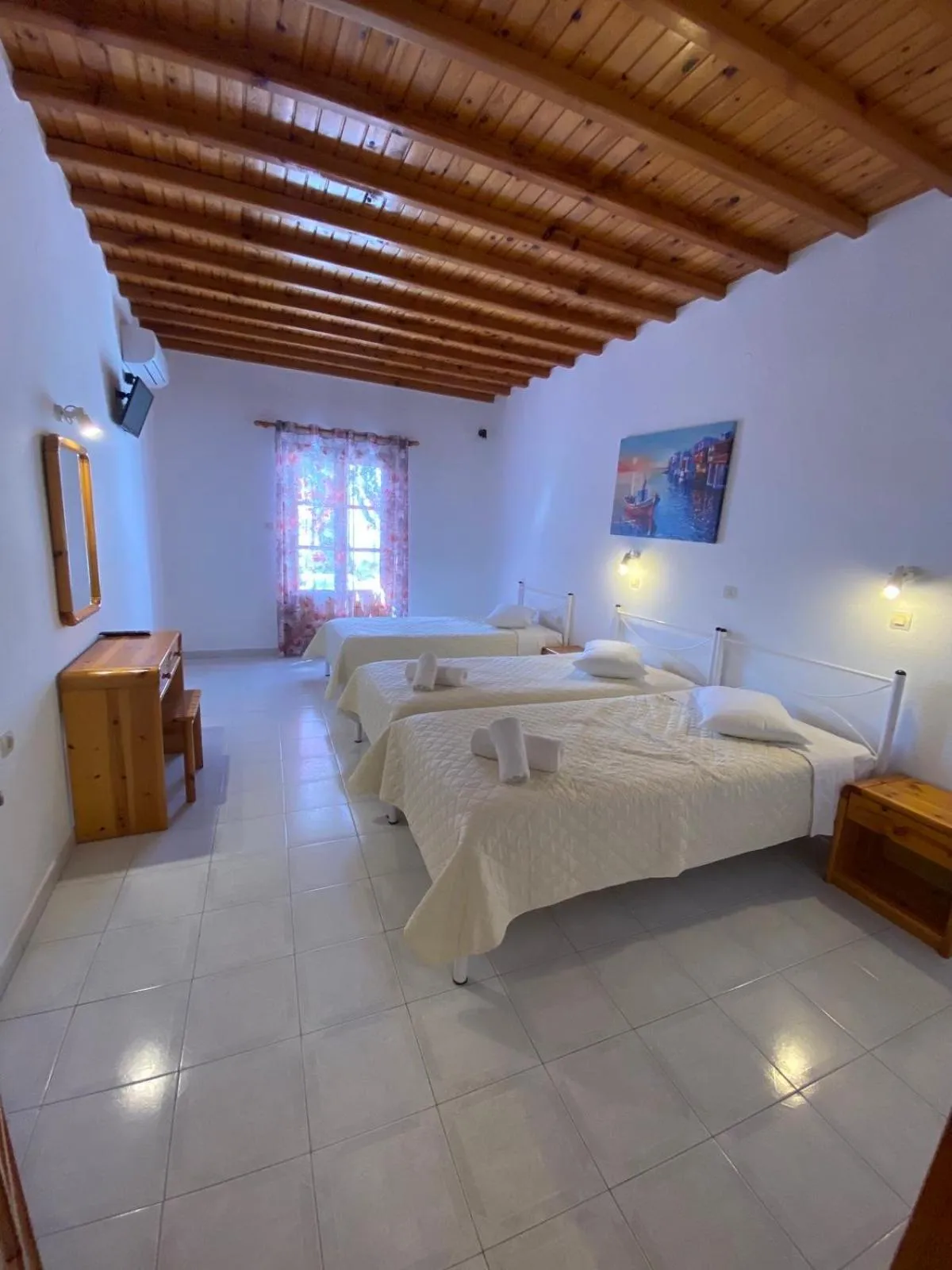 Bed in Anemos Hotel & Apartments