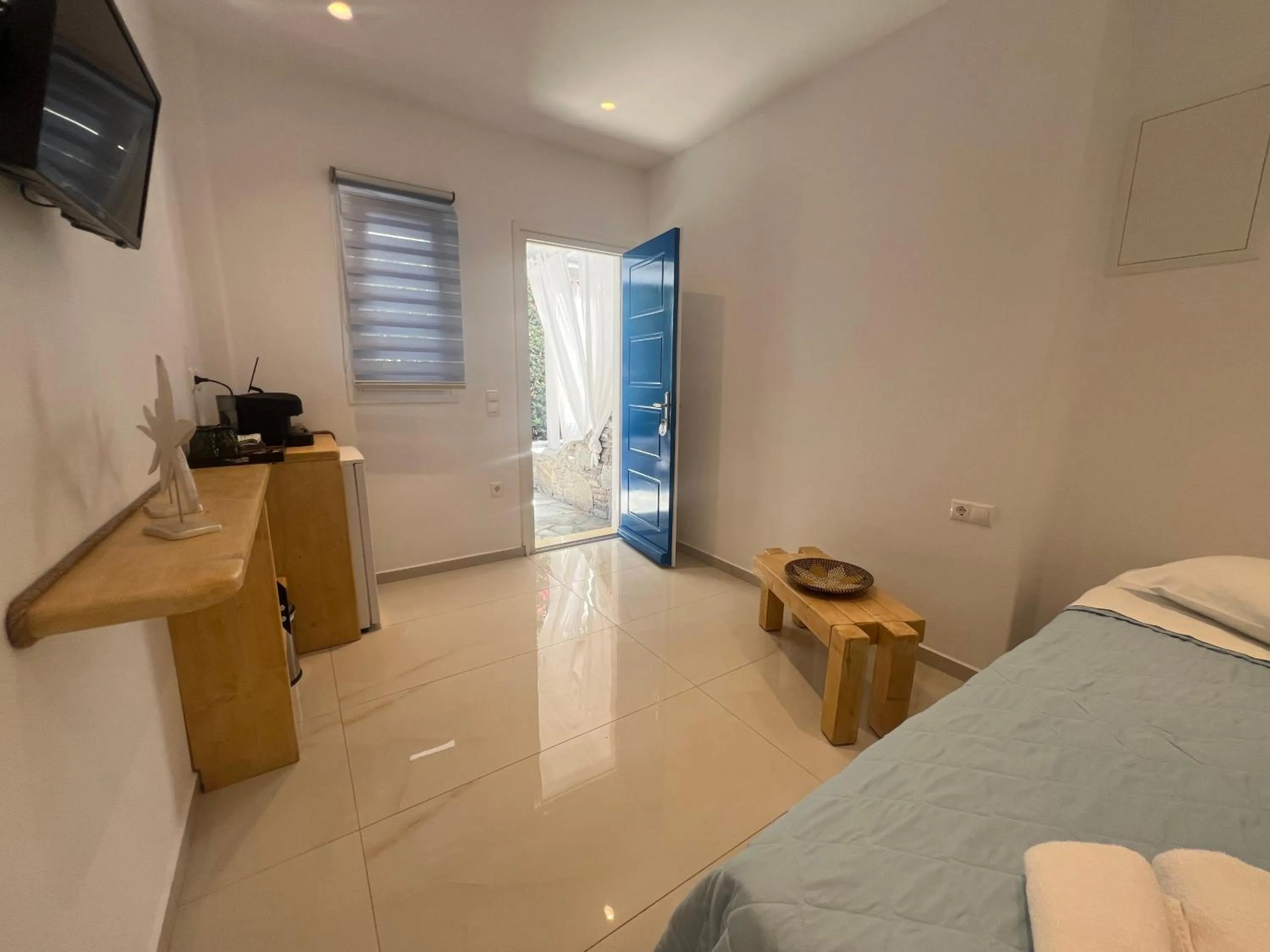 Bed in Anemos Hotel & Apartments