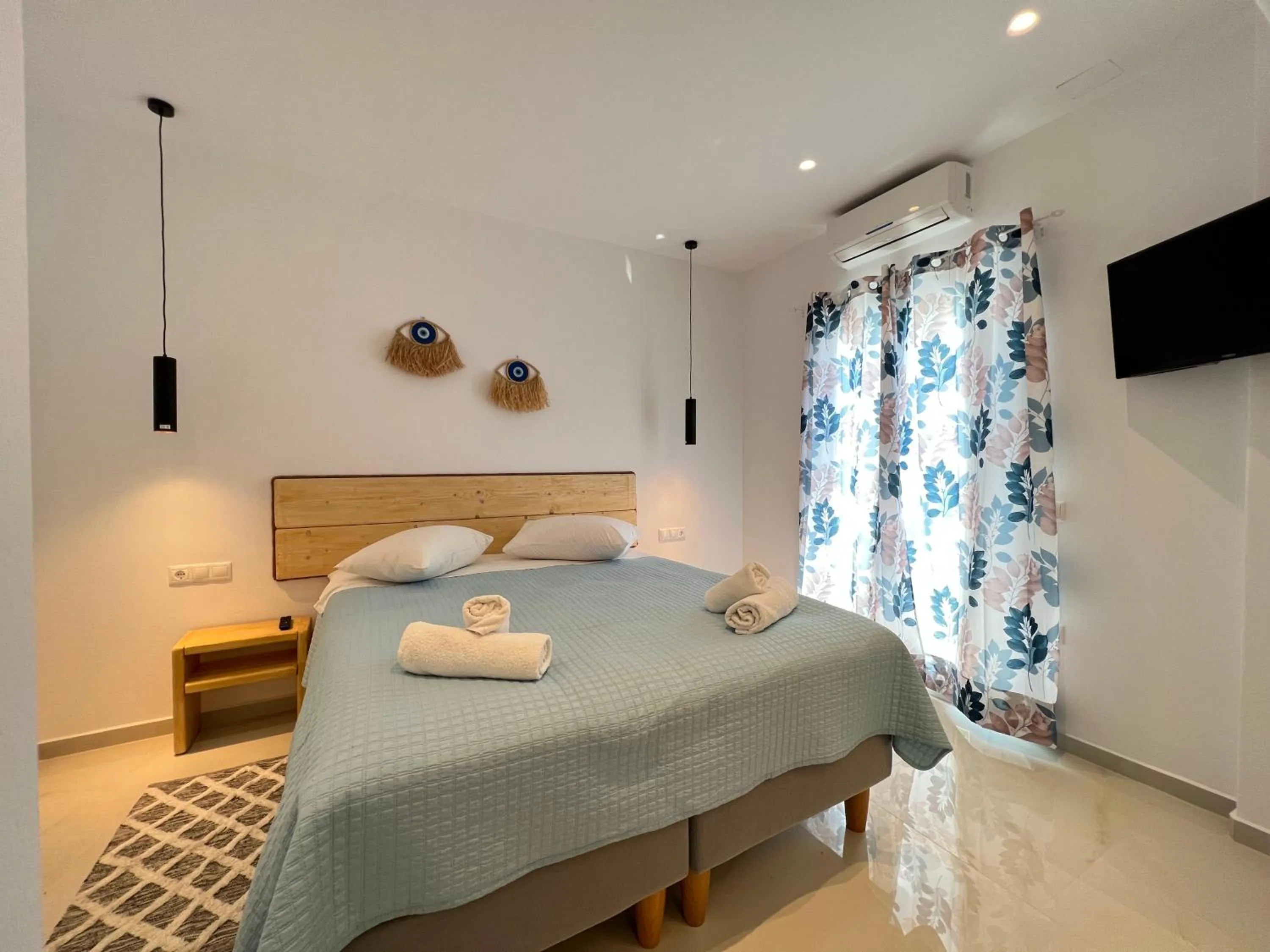 Bed in Anemos Hotel & Apartments