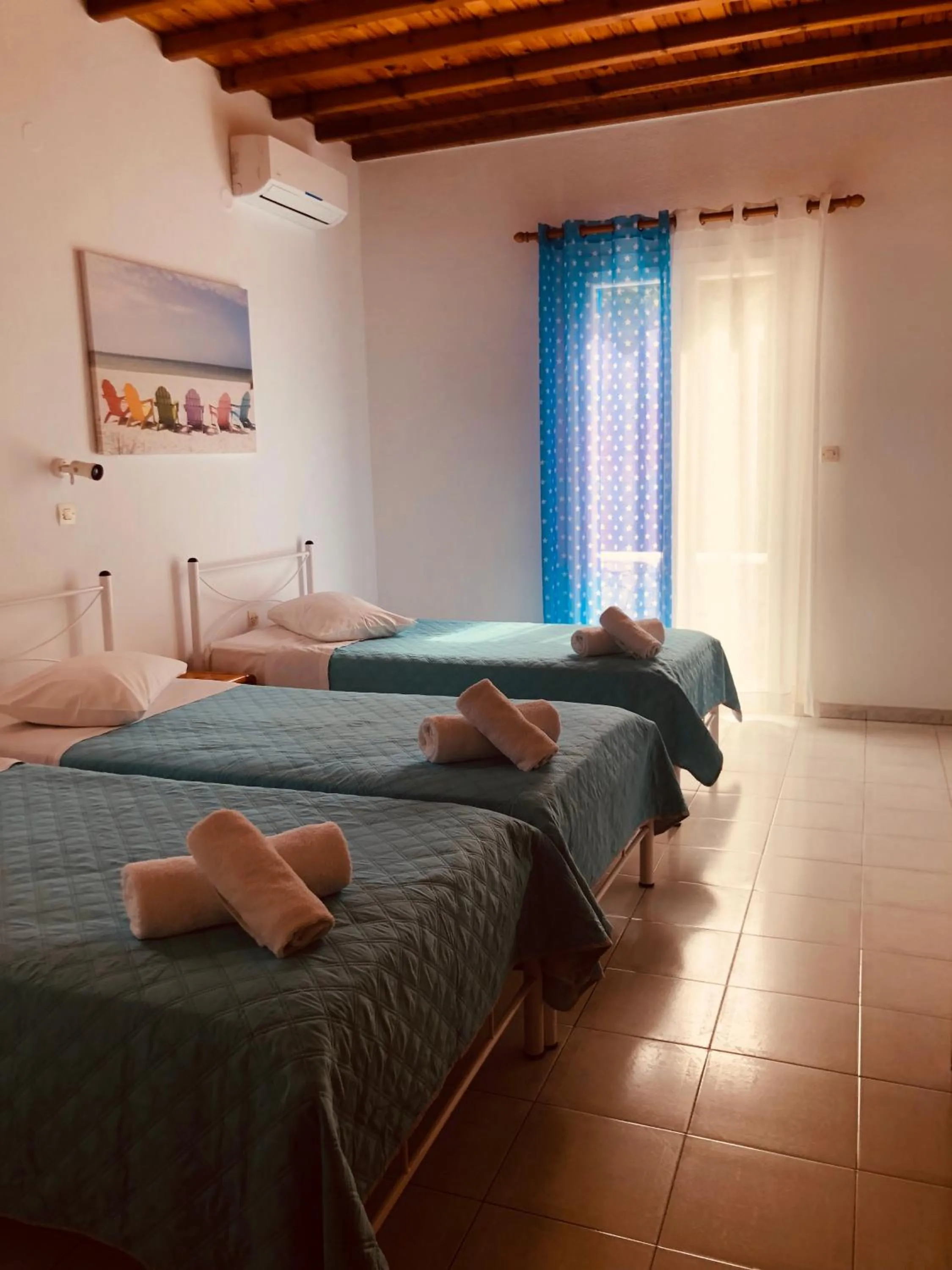 Bed in Anemos Hotel & Apartments