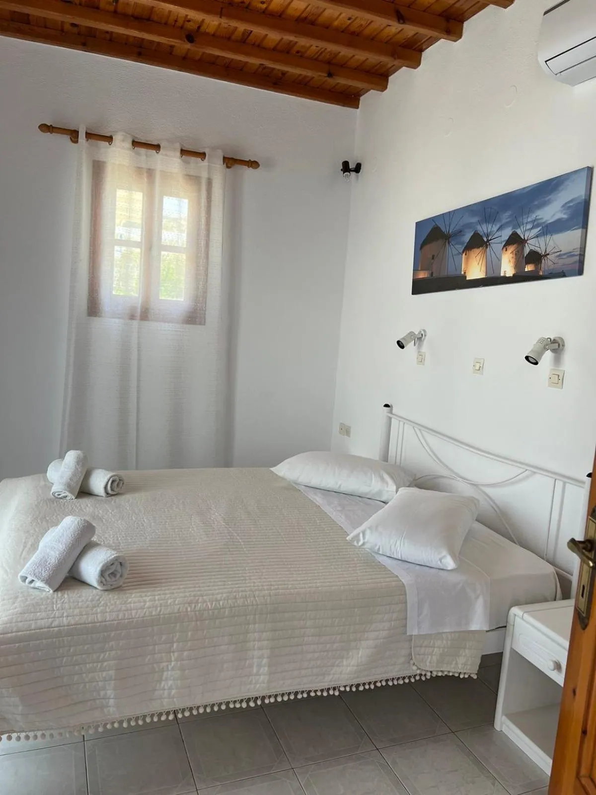 Bed in Anemos Hotel & Apartments