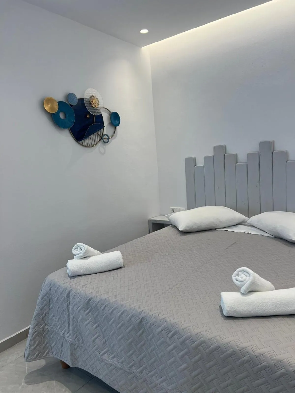 Bed in Anemos Hotel & Apartments