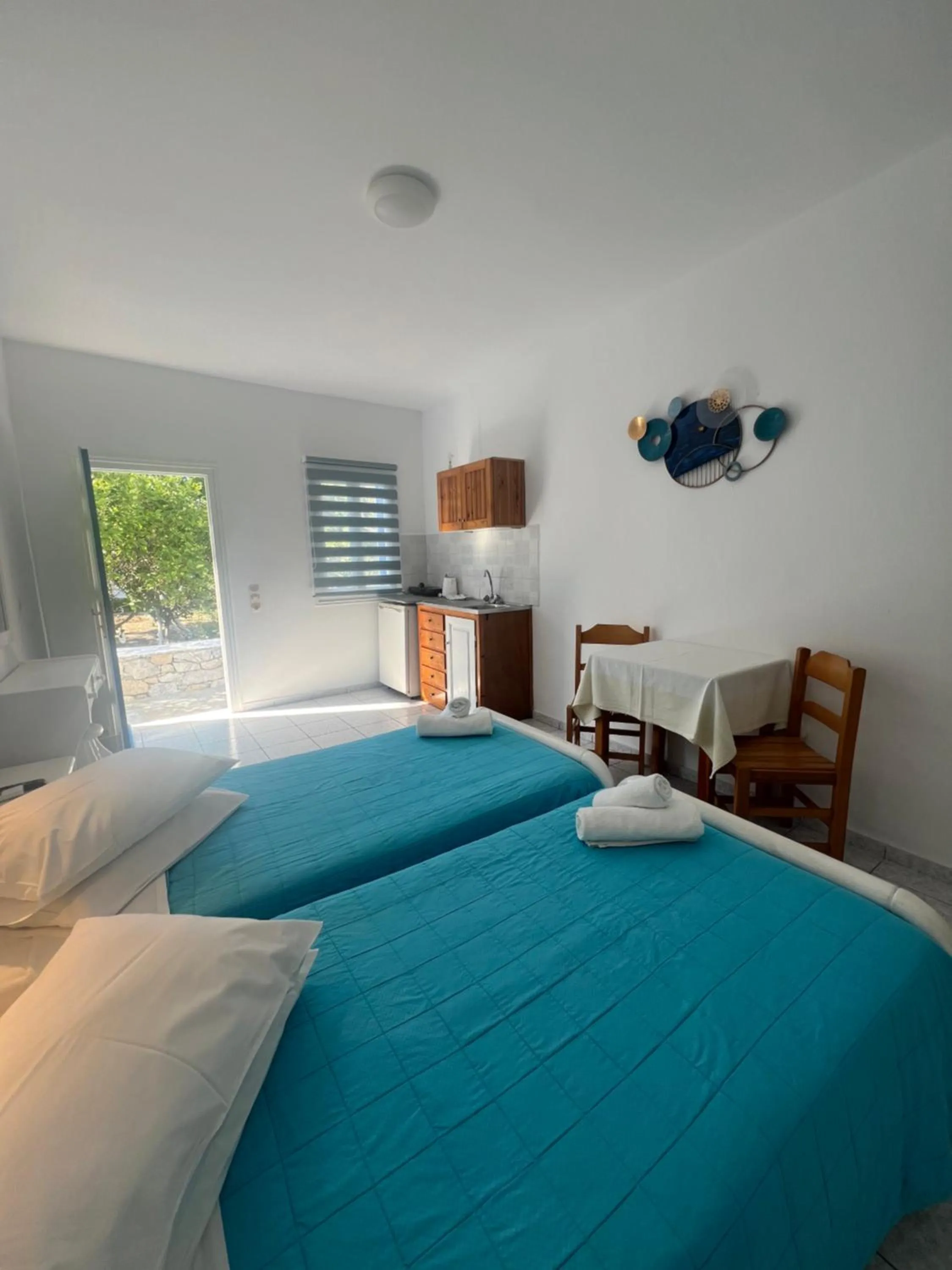 Bed in Anemos Hotel & Apartments