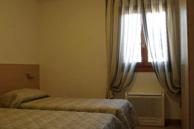 Bed in Hotel Ristorante Cigno - Camere and Aparthotel