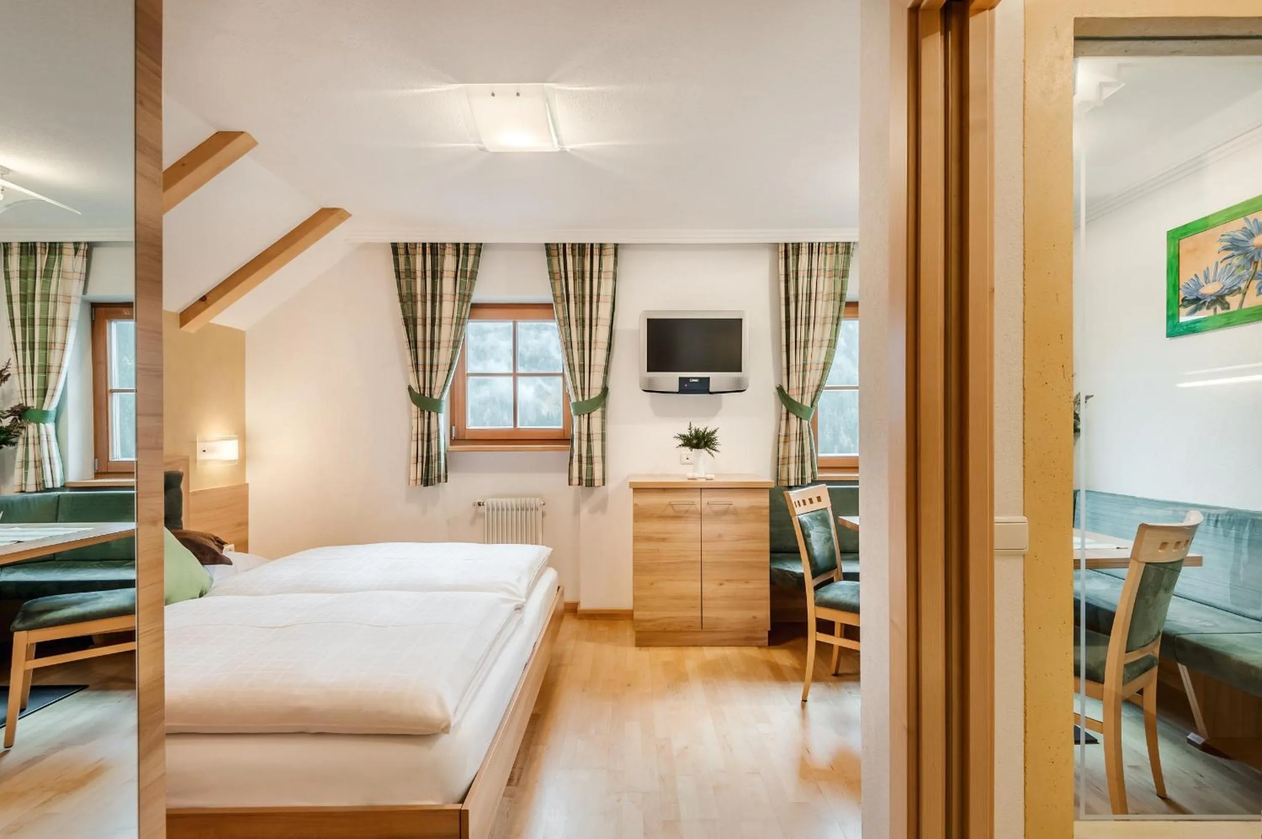 Living room, Bed in Taela Apartments