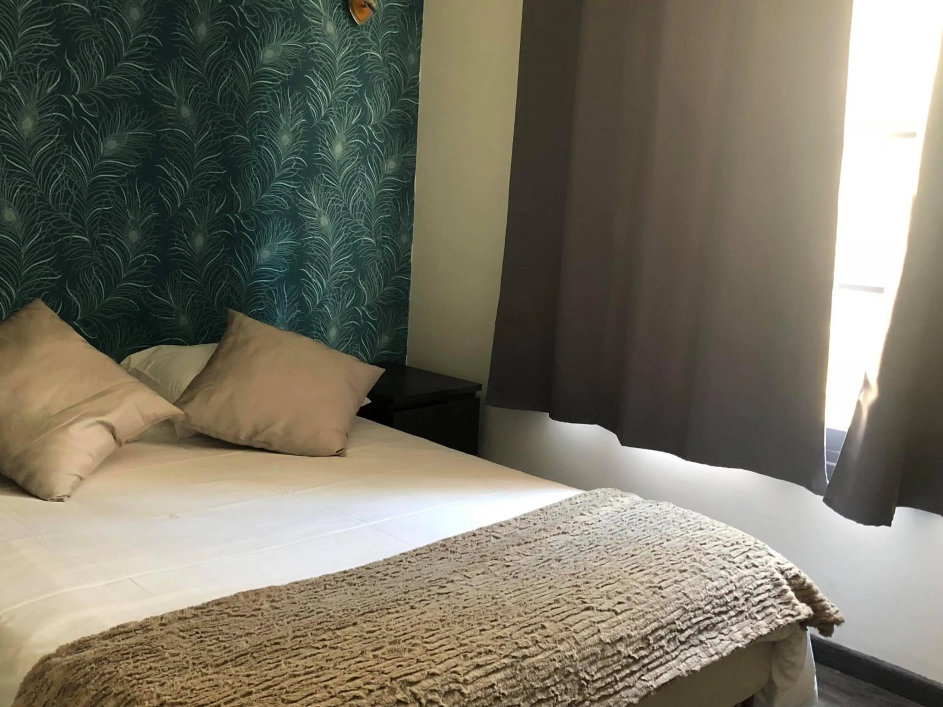 Bed in Hôtel des Beaux Arts