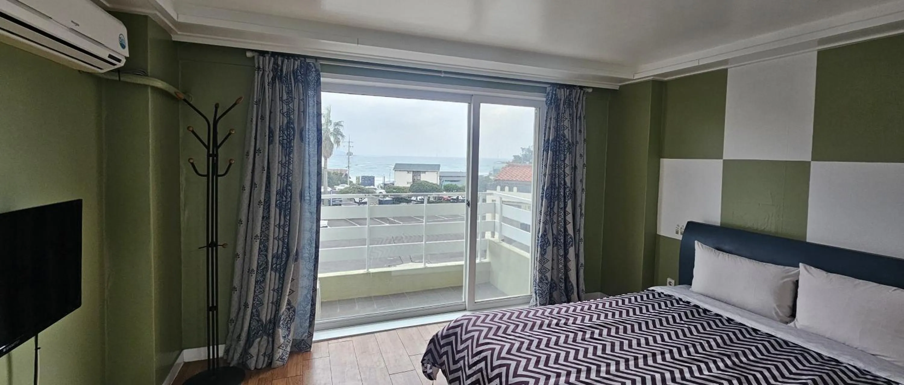 Bed in jeju Tovice Condo Ocean