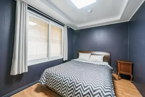 Bed in jeju Tovice Condo Ocean