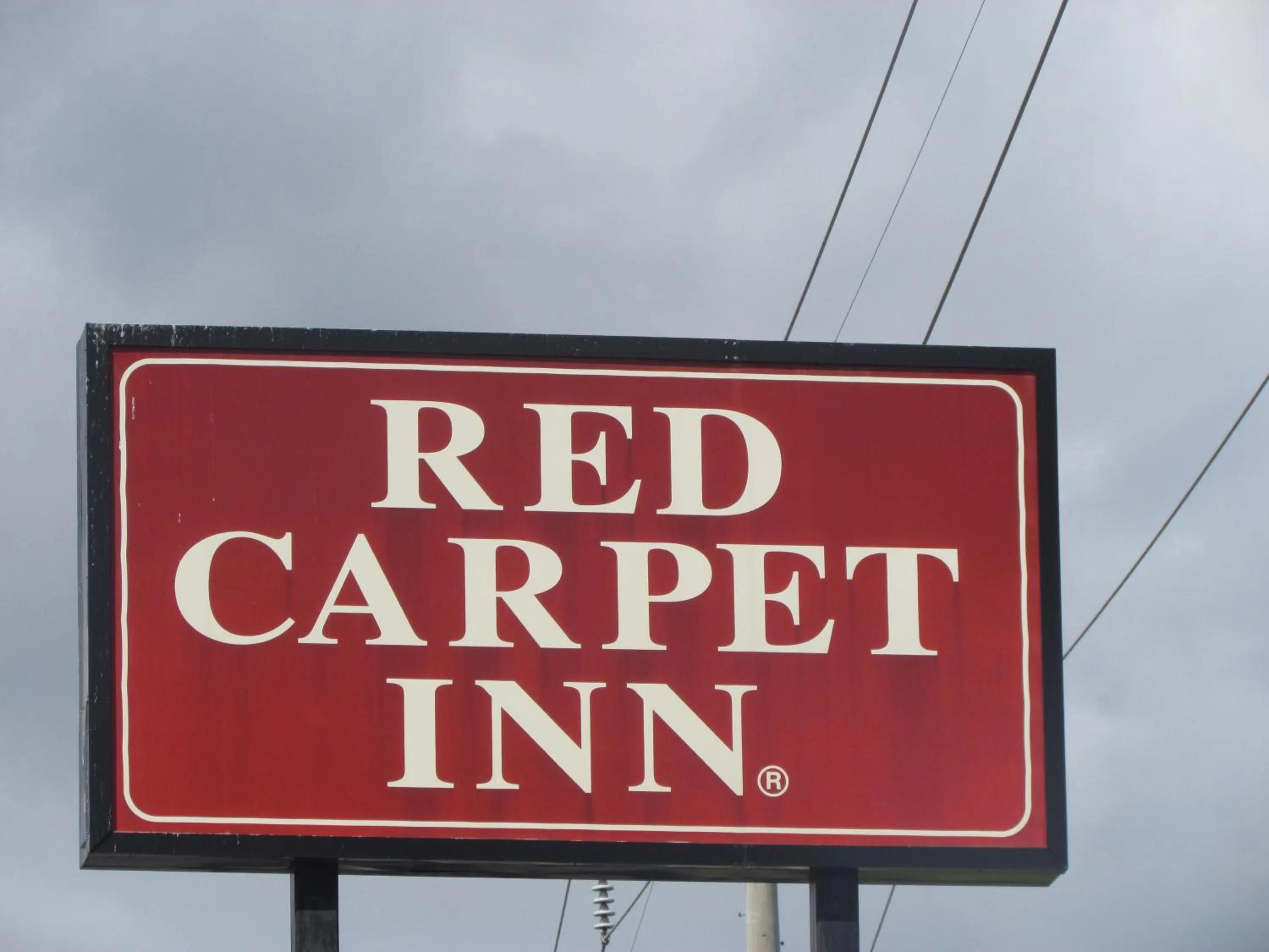 Property logo or sign in Red Carpet Inn - Augusta