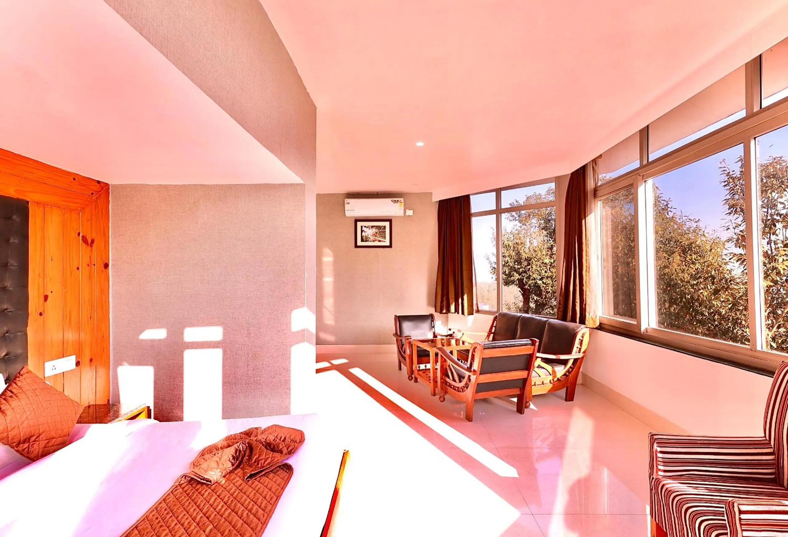 Seating area, Bed in Blue Pine Resort