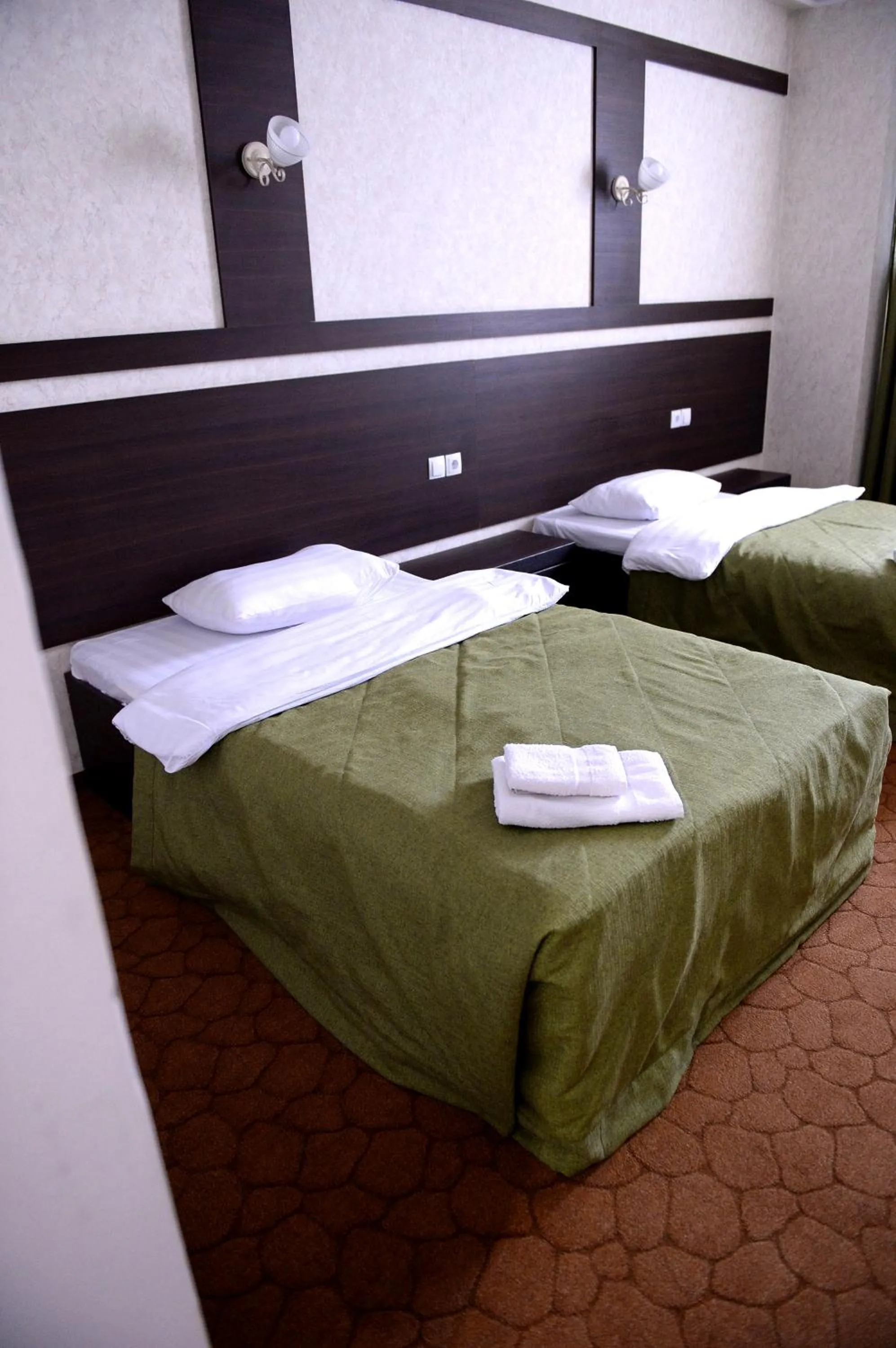 Bed in Pride Hotel