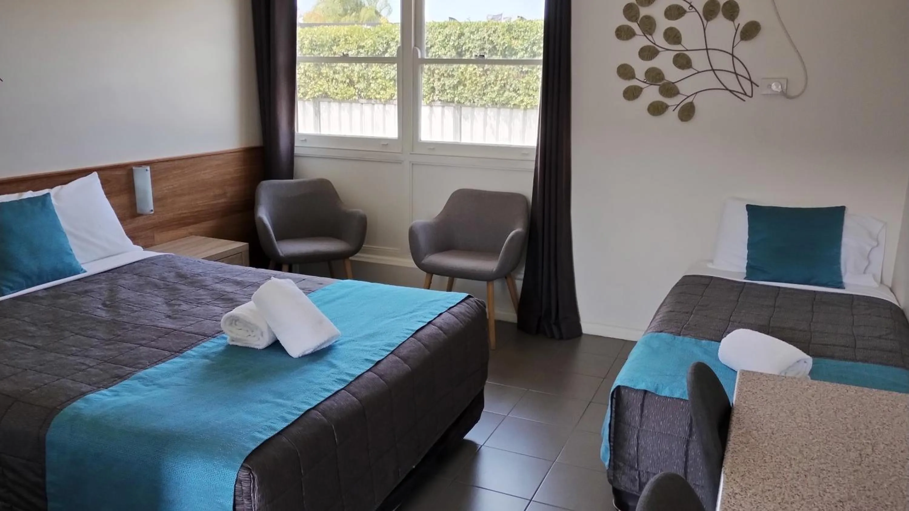 Bed in Caravilla Motor Inn