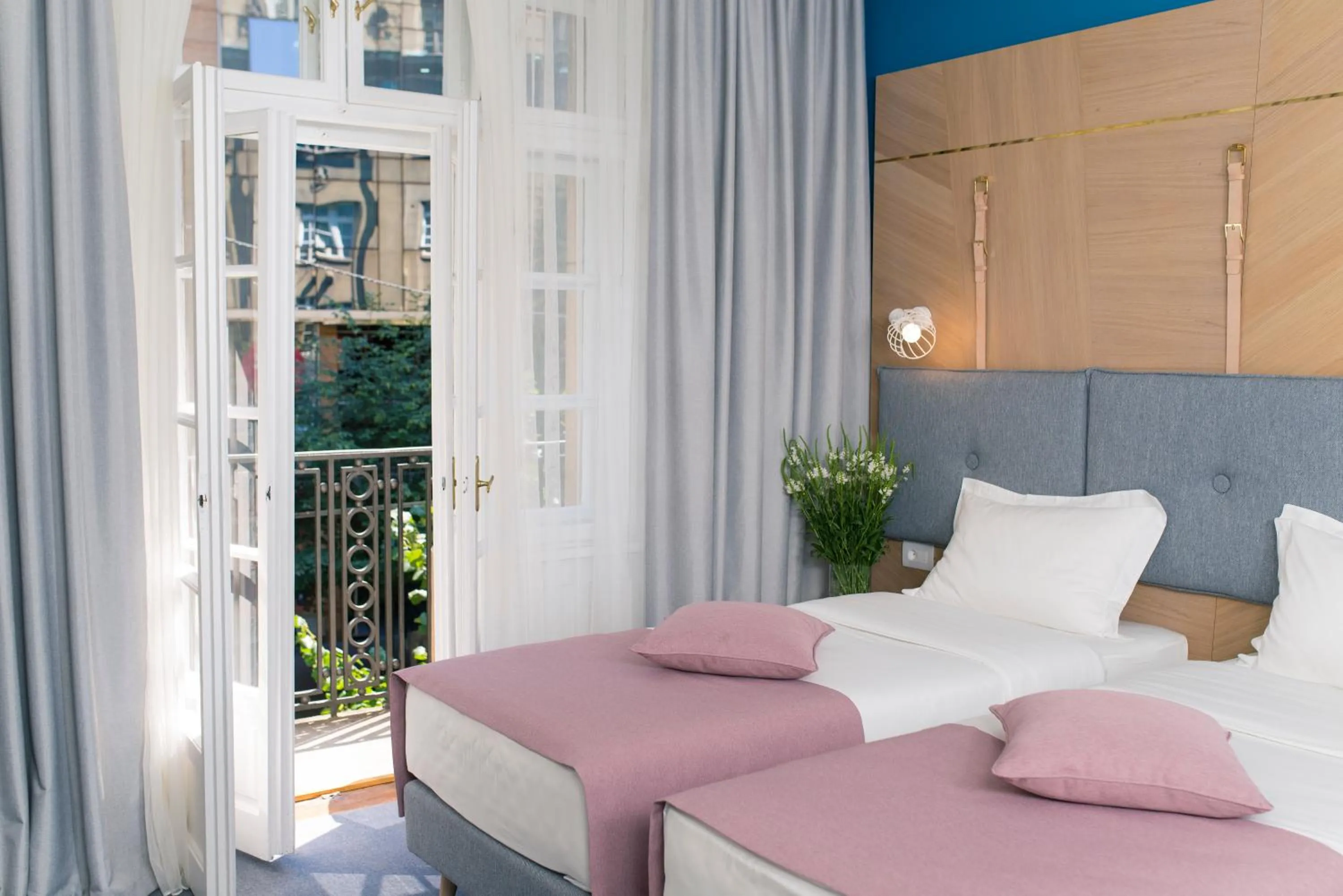 Bed in City Nest Modern & Cozy Suites