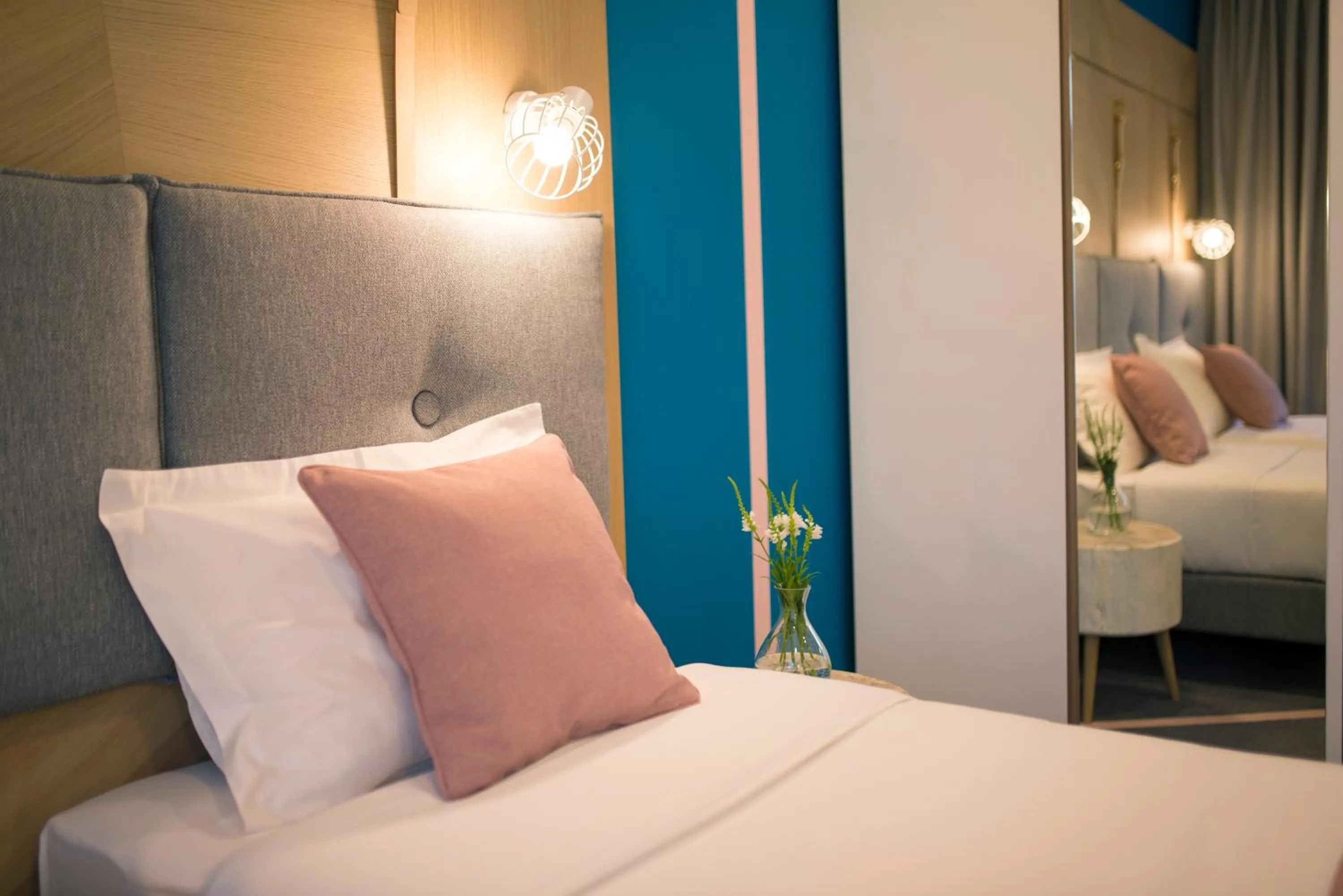 Bed in City Nest Modern & Cozy Suites