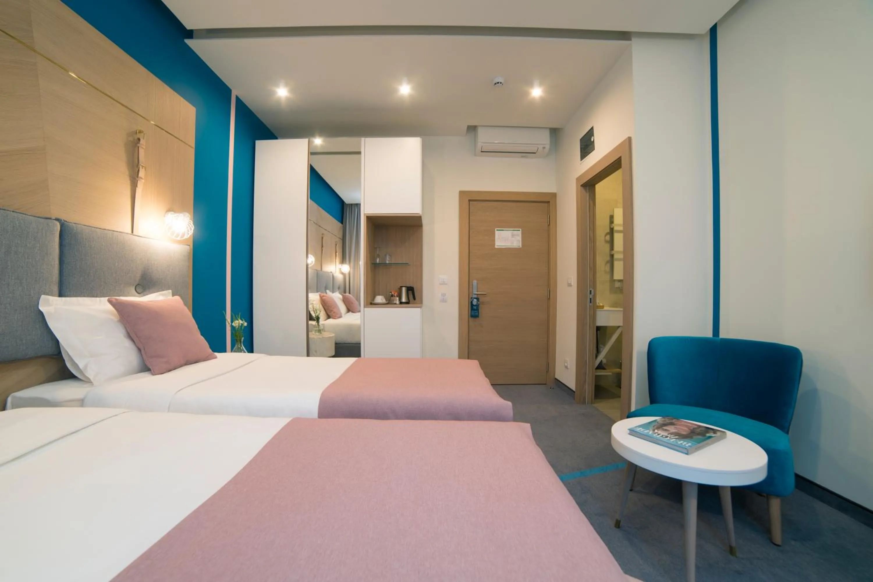 Bed in City Nest Modern & Cozy Suites