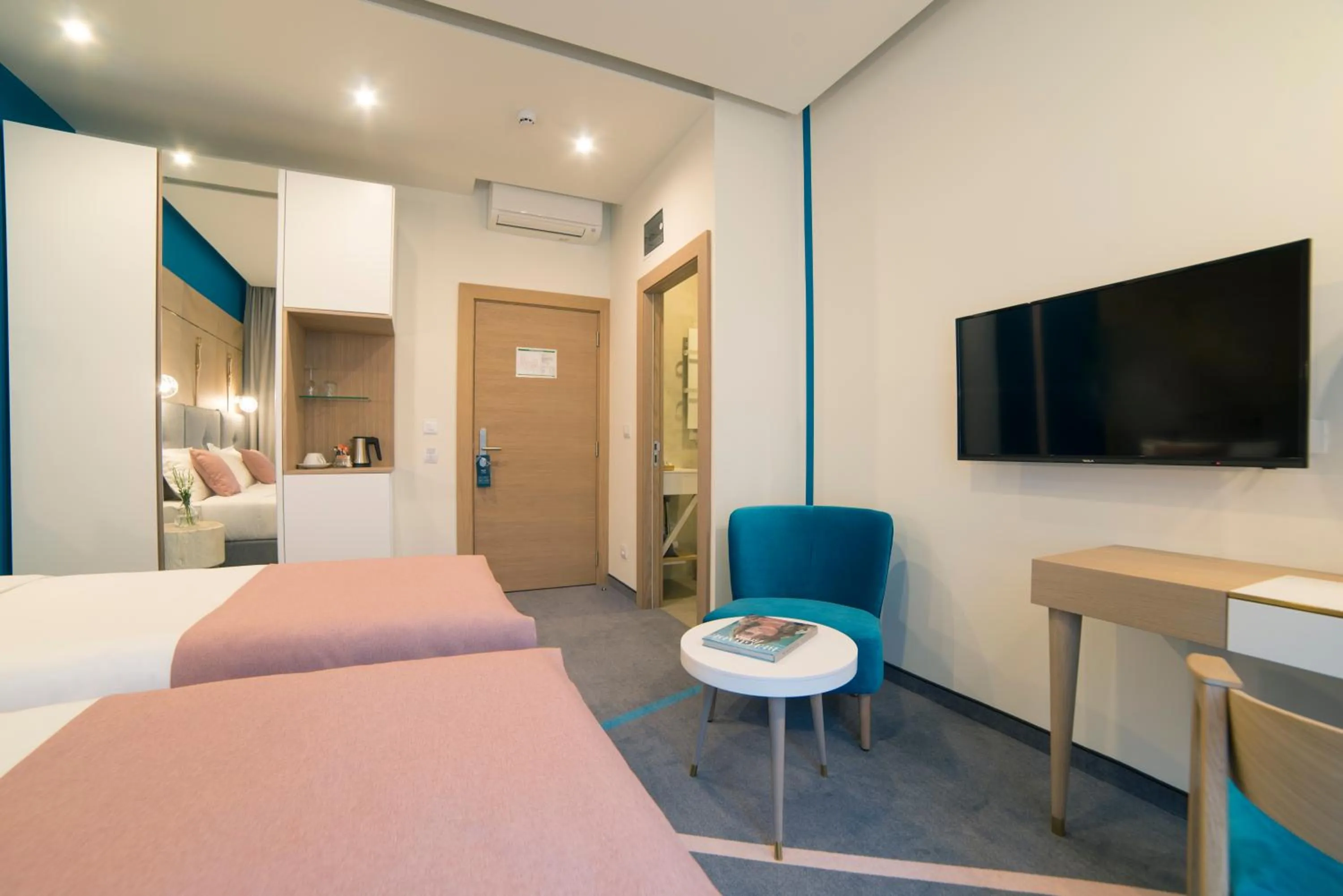 Bed in City Nest Modern & Cozy Suites