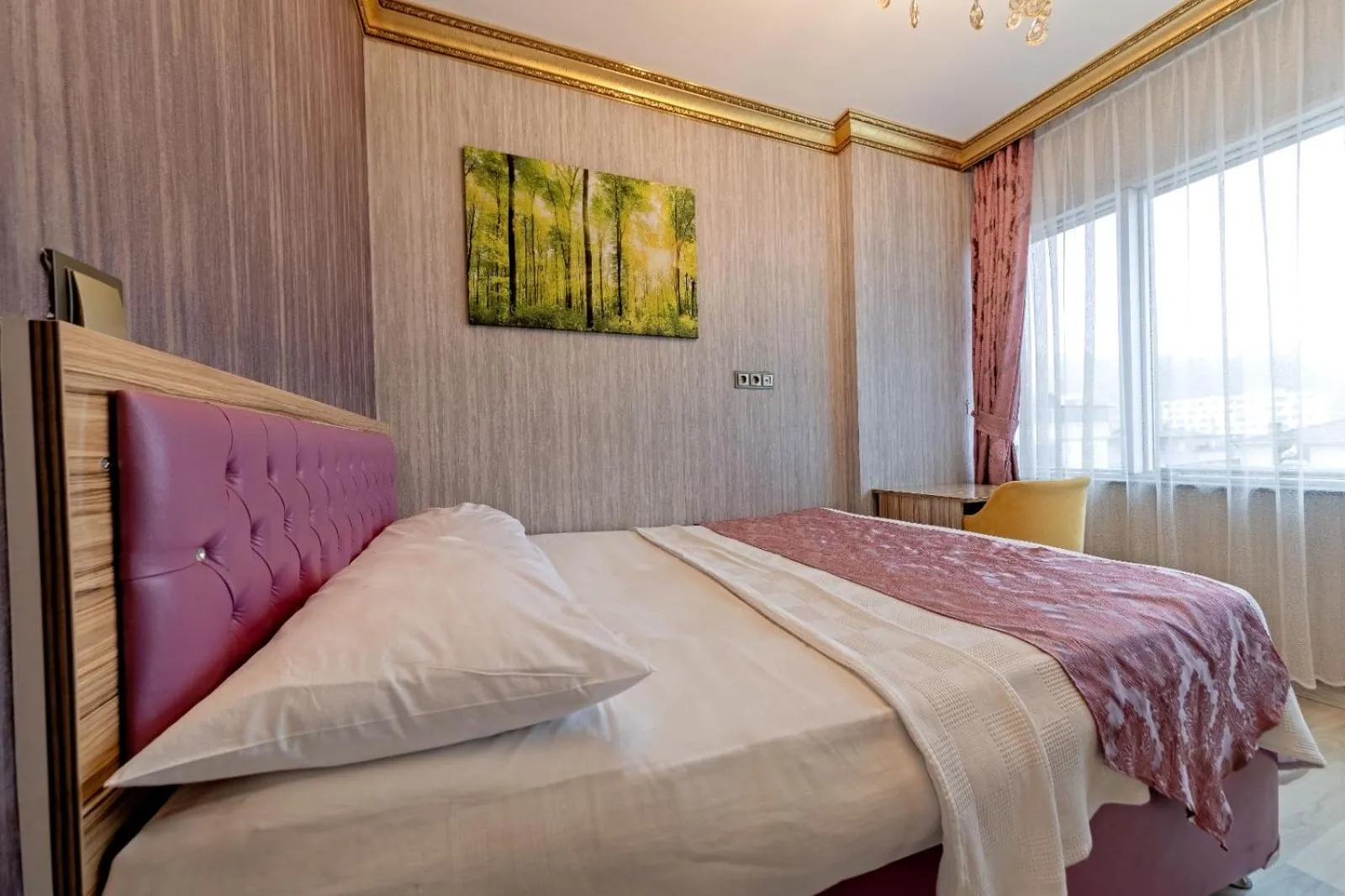 Bed in Royal Babil Suites Hotel