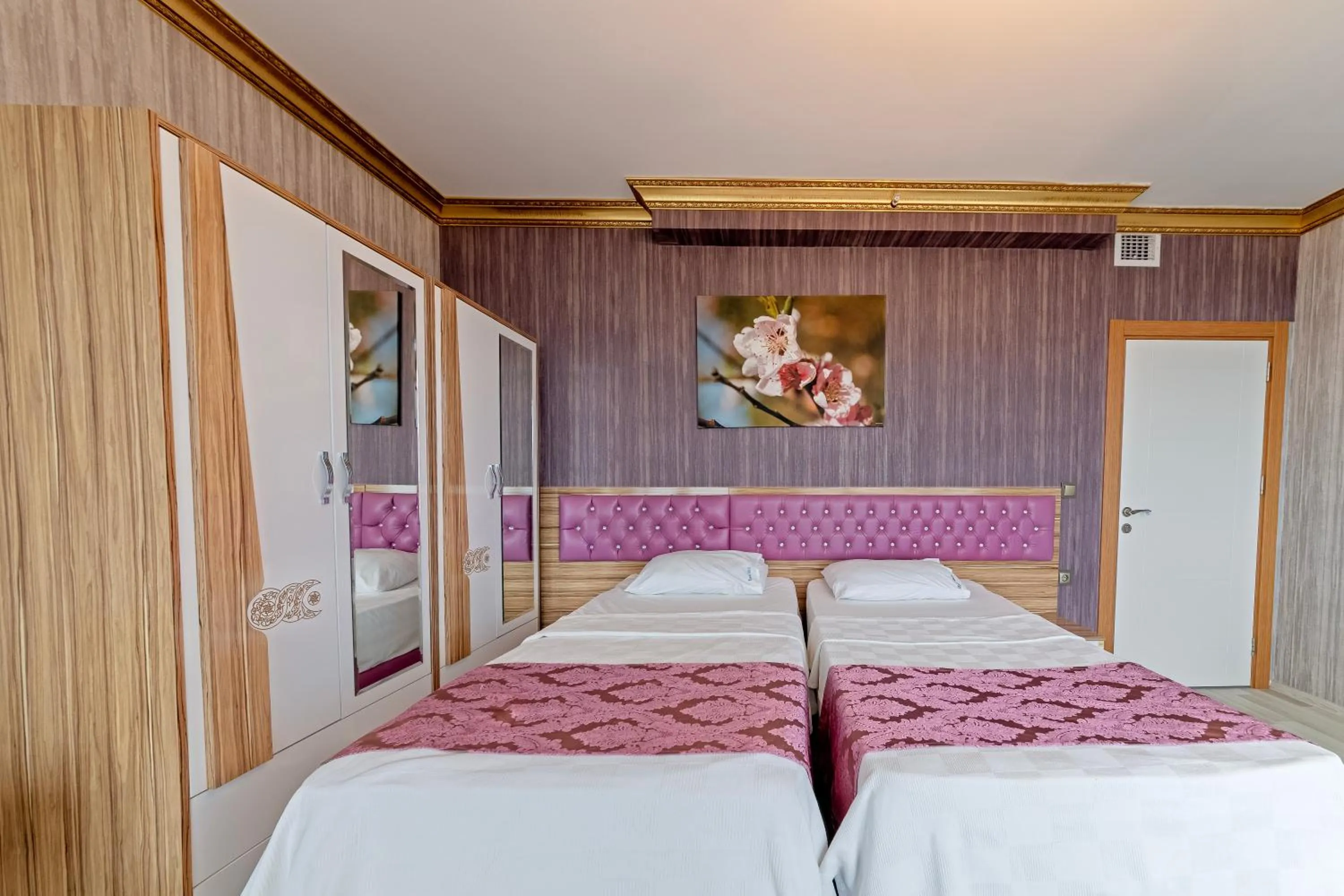 Bed in Royal Babil Suites Hotel