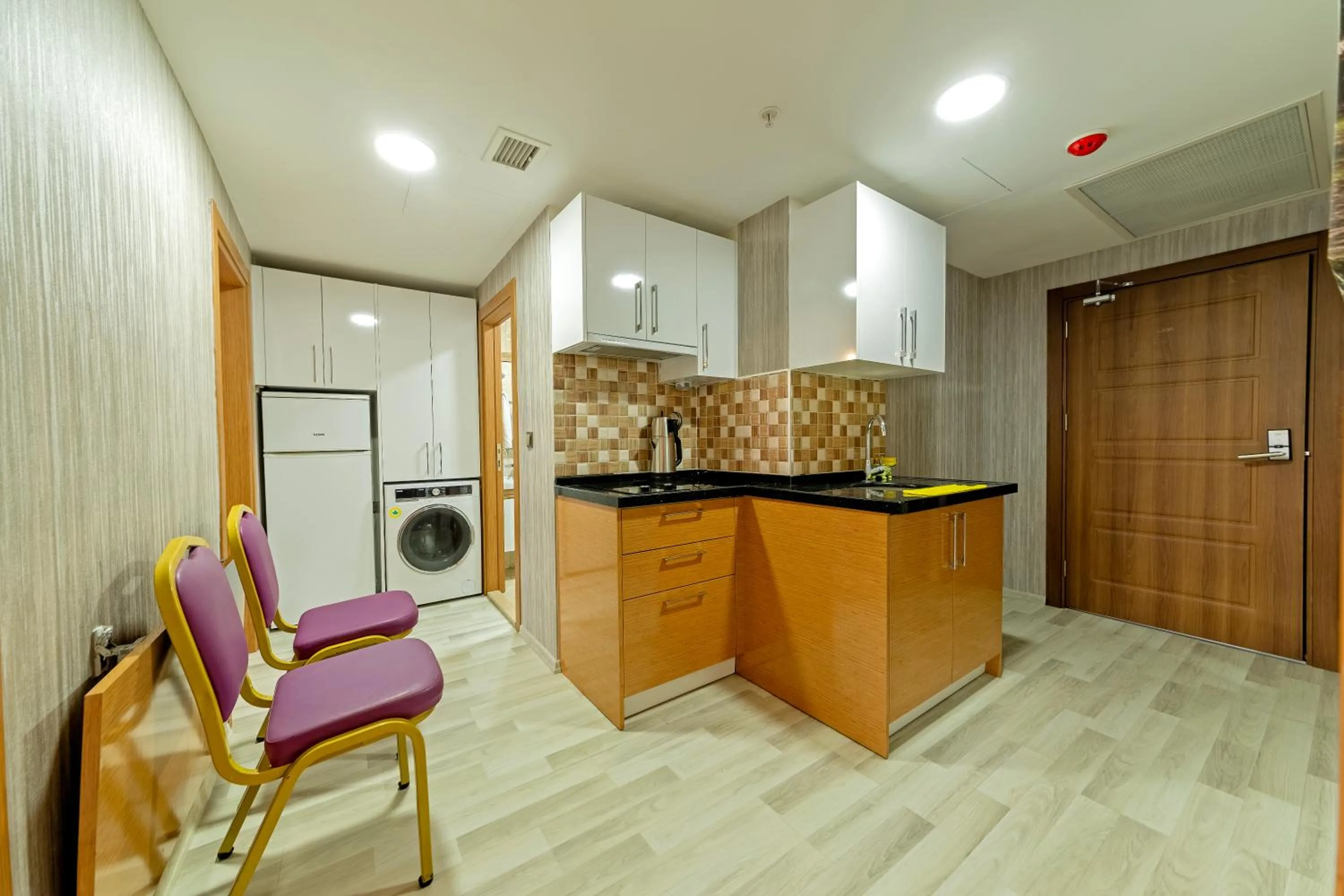 Kitchen or kitchenette in Royal Babil Suites Hotel