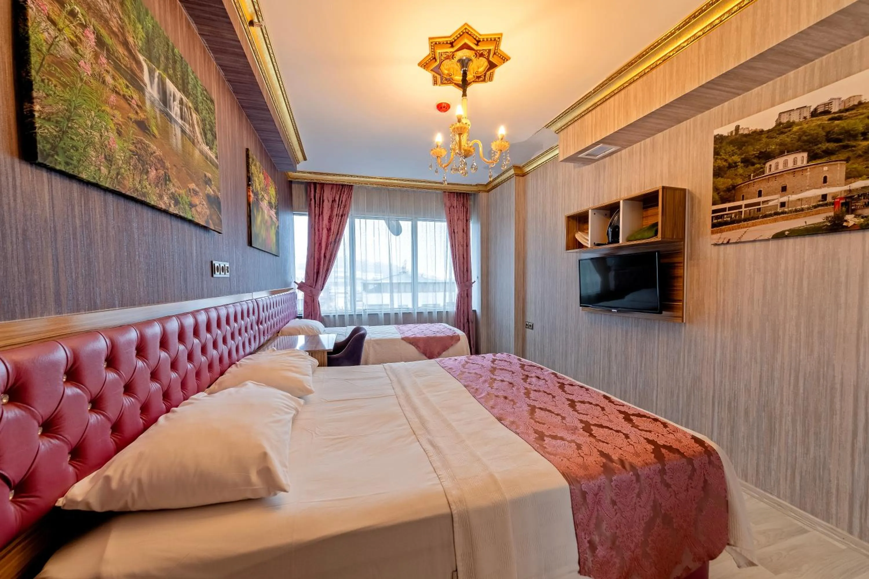 Bed in Royal Babil Suites Hotel
