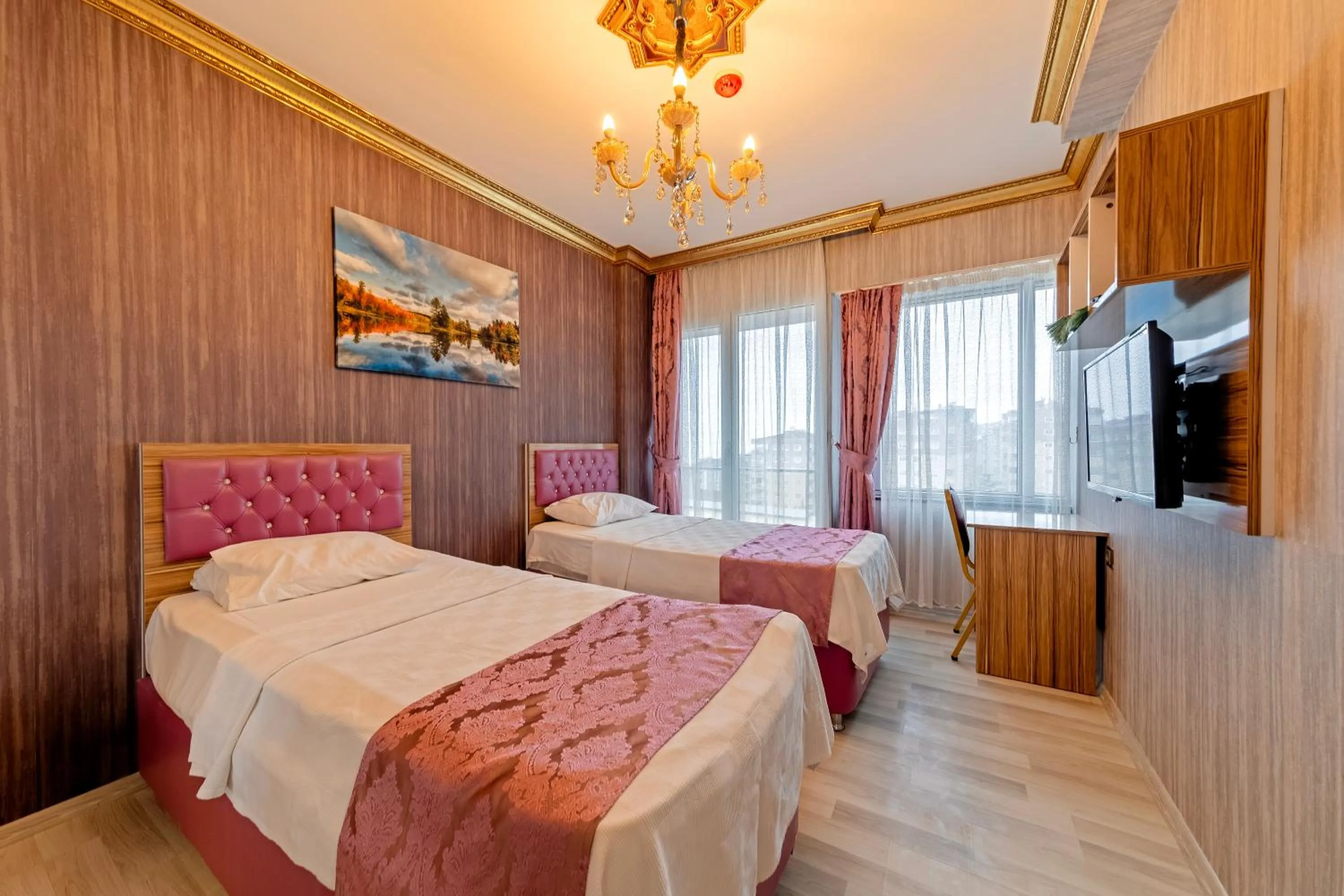 Bed in Royal Babil Suites Hotel