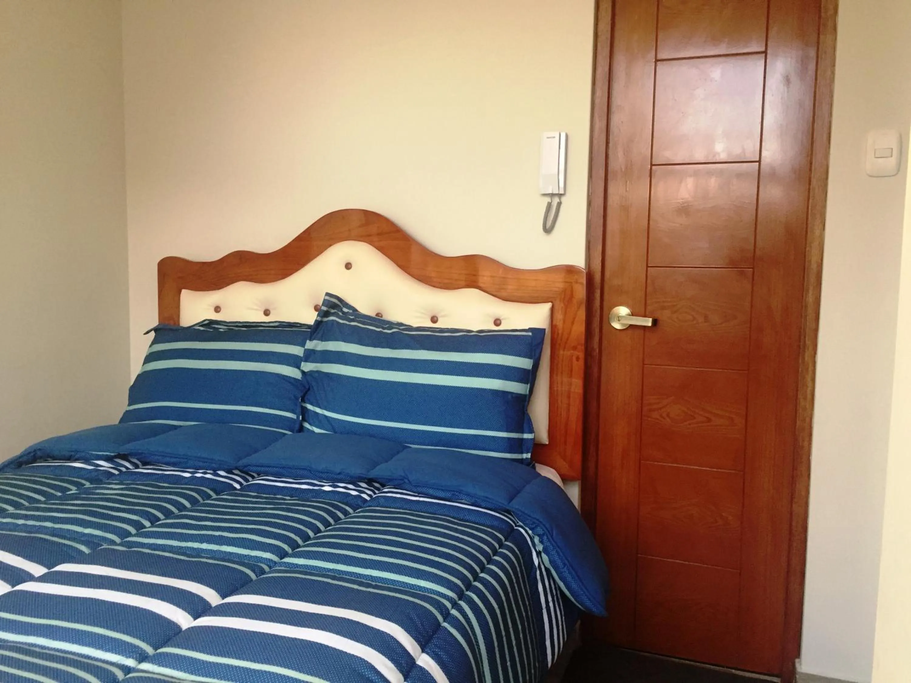 Bed in A-Hope Suite Hotel