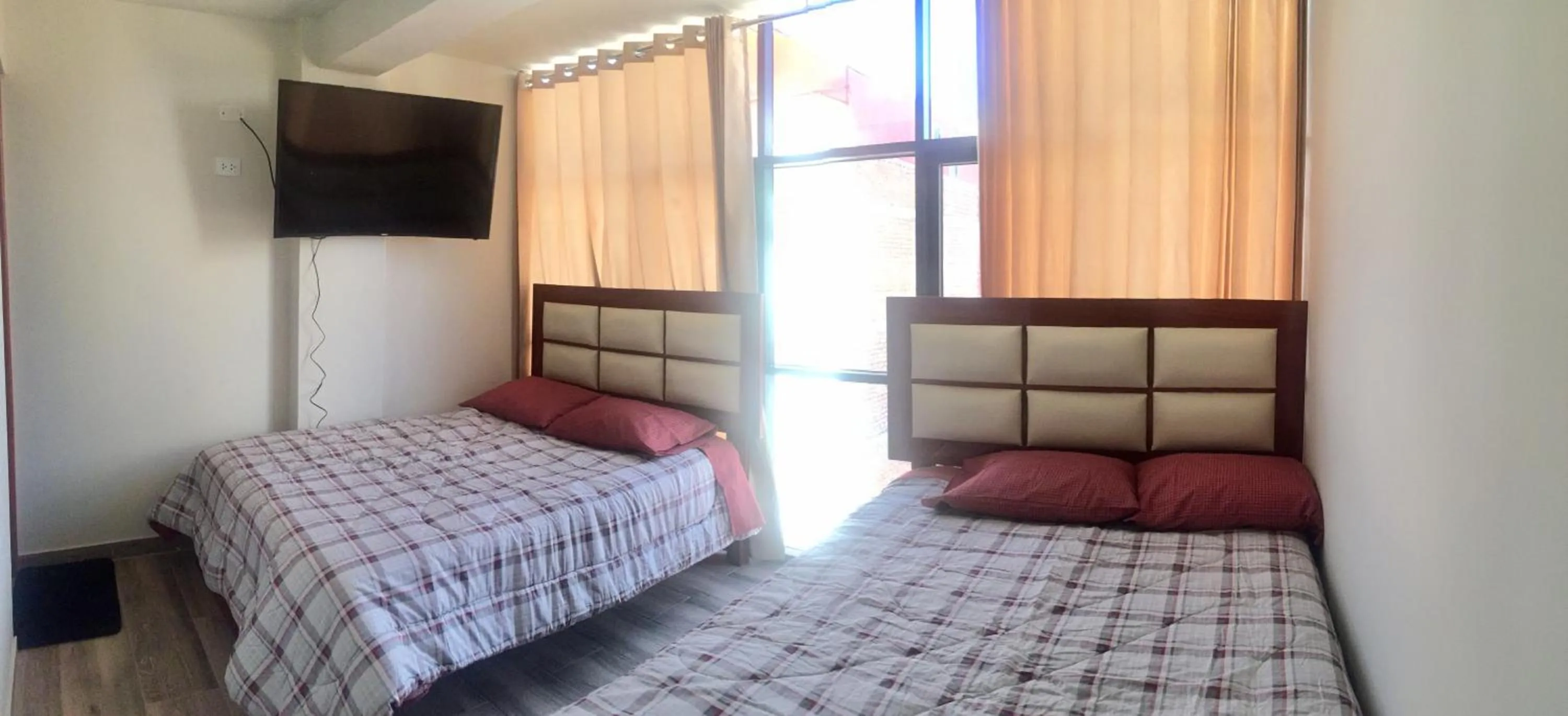 Bed in A-Hope Suite Hotel